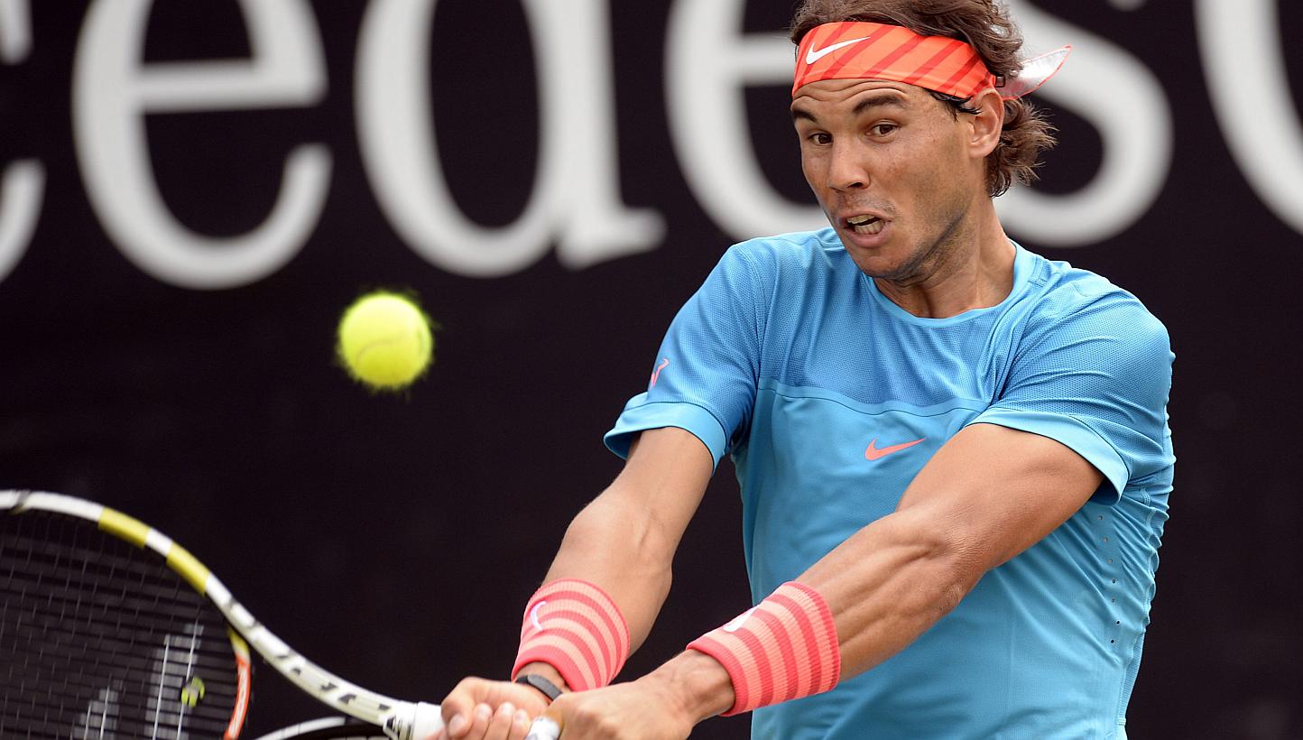 Spain's Rafael Nadal returns the ball to Marcos Baghdatis of Cyprus at the ATP Mercedes Cup in Stuttgart, southern Germany, on June 11, 2015. -- PHOTO: AFP&nbsp;