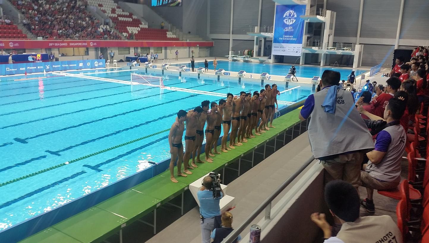 Singapore's men's water polo team acknowledging the crowd after their 17-2 win over Thailand at the OCBC Aquatic Centre on June 12, 2015. -- ST PHOTO: ISAAC NEO&nbsp;