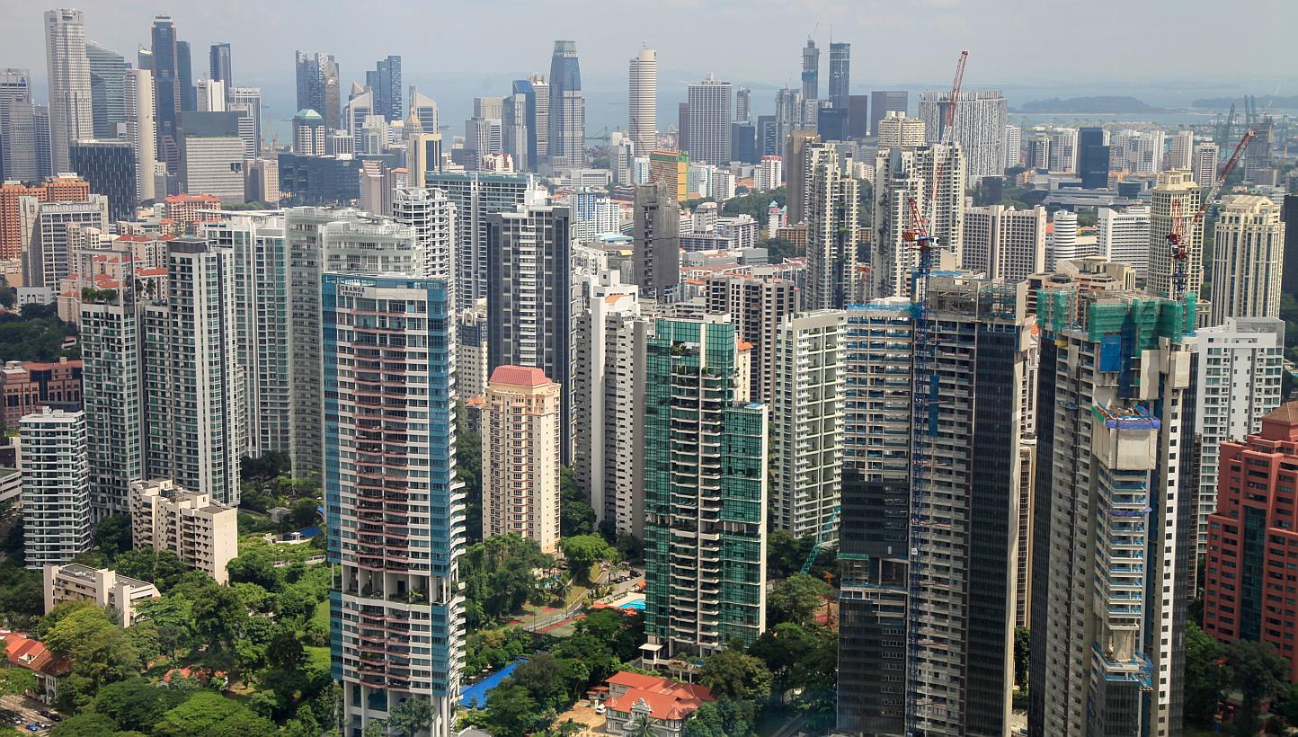 Residential buildings stand in the Grange Road area of Singapore. Buyers with HDB addresses are opting for smaller apartments when they venture into the private housing market, according to DTZ Research. -- ST PHOTO: BLOOMBERG