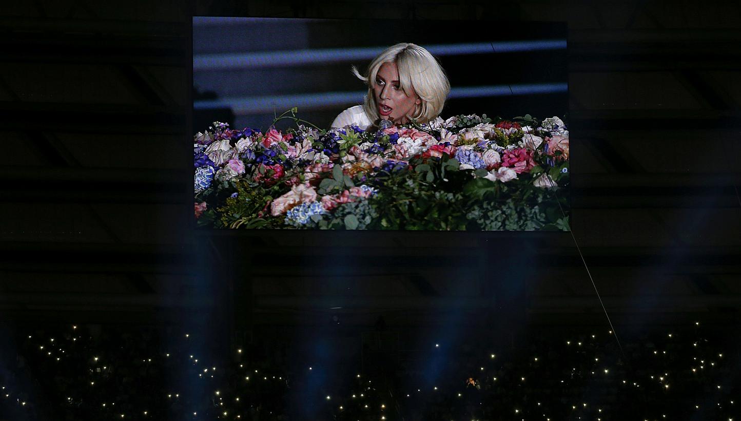 Singer Lady Gaga is displayed on a videowall while fans light their phones during the opening ceremony of the 1st European Games in Baku, Azerbaijan, June 12 , 2015. -- PHOTO: REUTERS
