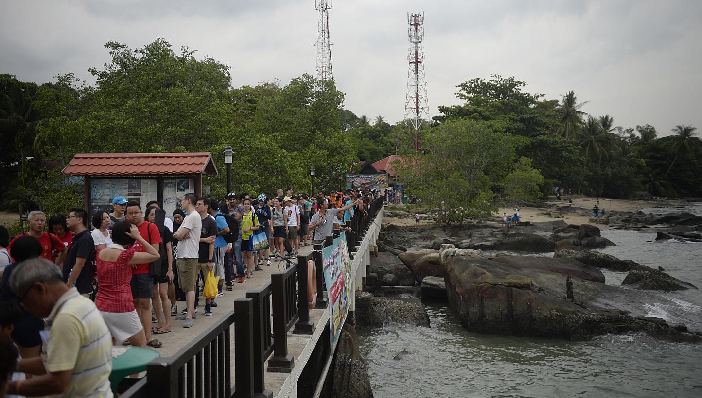 A large crowd waits along Pulau Ubin jetty during Ubin Day 2015 on June 13. A new integrated lab facility equipped with scientific equipment to help researchers and students study Pulau Ubin island will be ready by the end of the year.&nbsp;-- ST PHO
