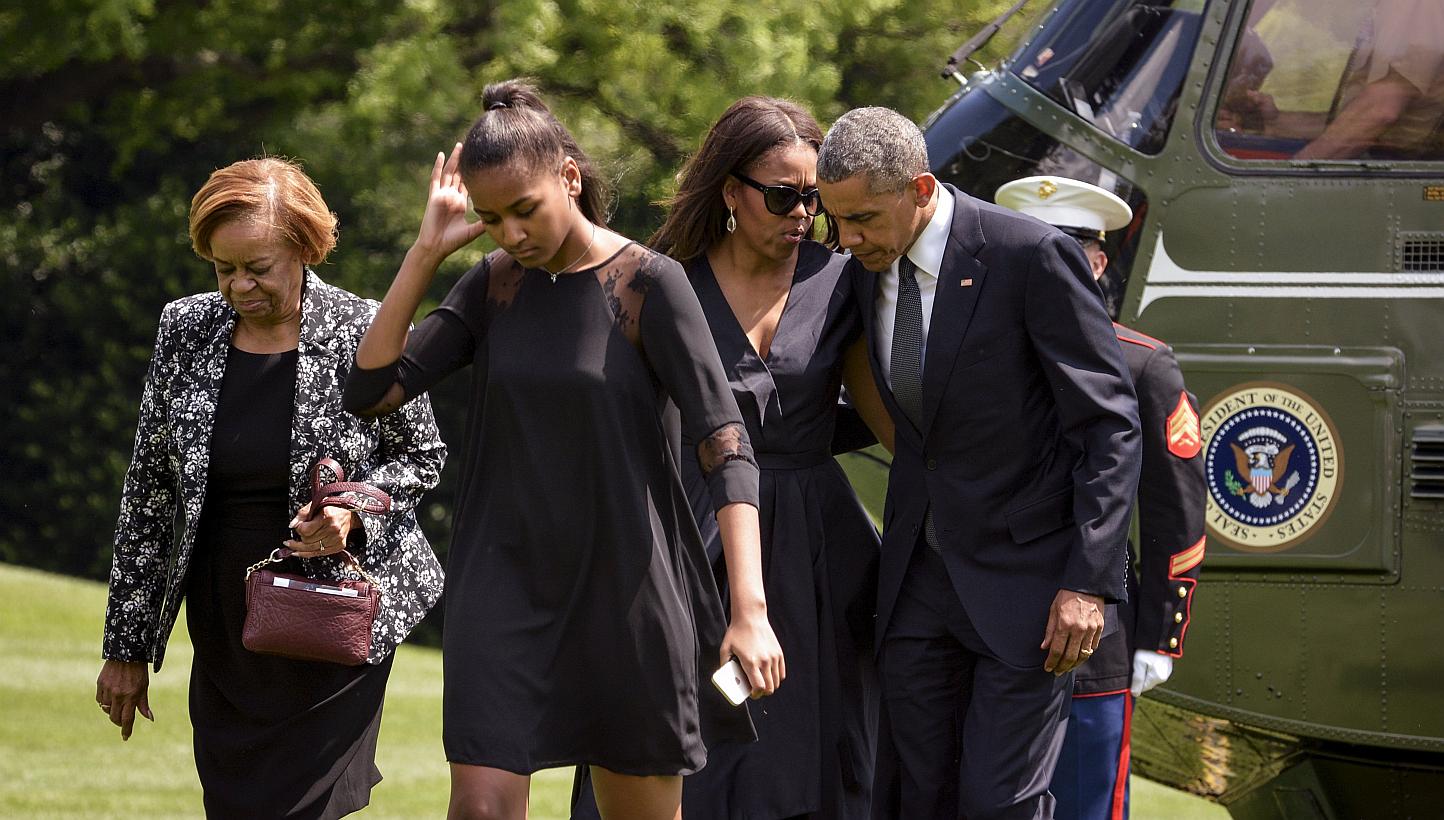 US President Barack Obama with first lady Michelle Obama, their daughter Sasha (second from left) and his mother in-law Marian Robinson (left). -- PHOTO: REUTERS 