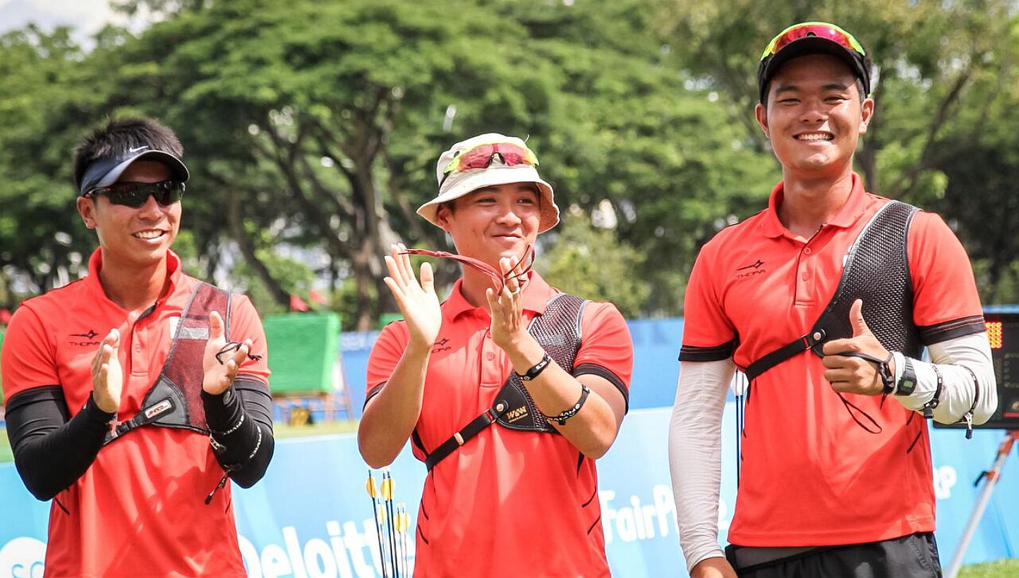 Singapore archers (from left) Tan Si Lie, Keith Teo and Zhang Jingkang won bronze in the men's team recurve event on June 13, 2015. -- PHOTO: DYAN TJHIA/SPORT SINGAPORE