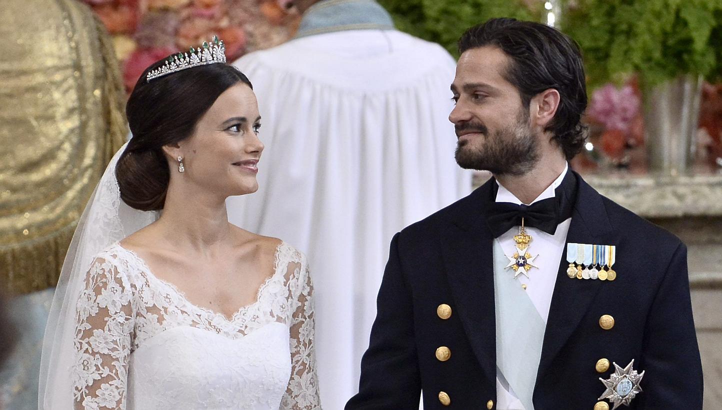 Sofia Hellqvist and Sweden's Prince Carl Philip stand at the alter during their wedding ceremony at the Royal Chapel in Stockholm Palace on June 13, 2015. -- PHOTO: AFP