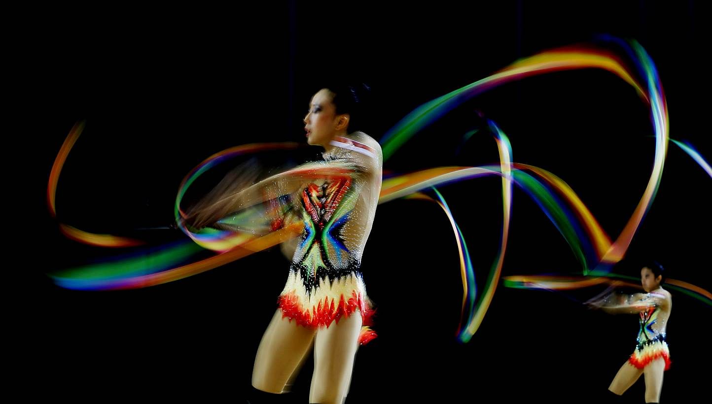 Singapore's rhythmic gymnasts warming up before the group all-around event at the Bishan Sports Hall on June 14, 2015. -- PHOTO: SINGAPORE SEA GAMES ORGANISING COMMITTEE/ACTION IMAGES VIA REUTERS