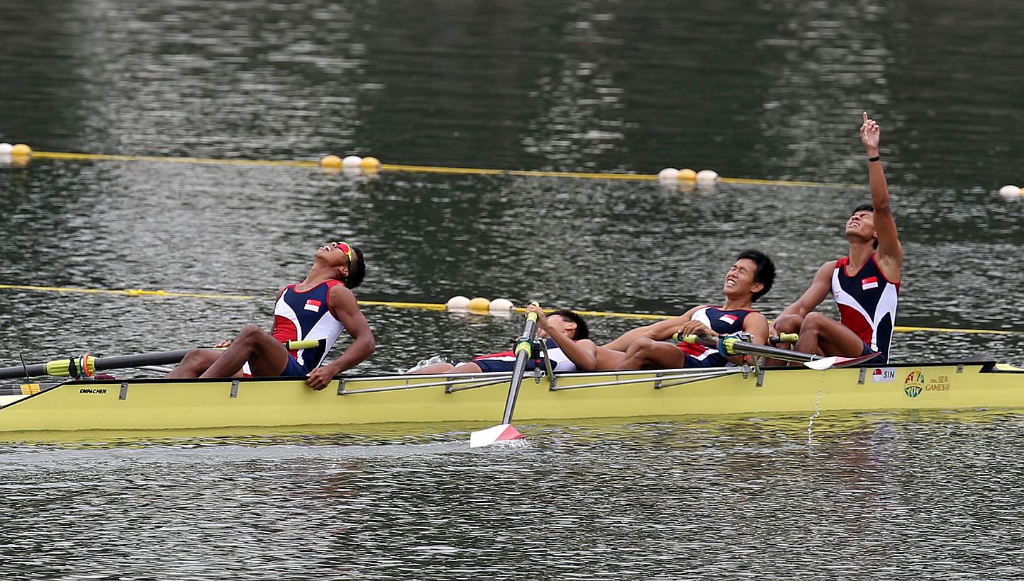 Singapore's men's lightweight coxless four team of (from left) Nadzrie Hyckell Hamazah, Lee Zong Han, Pek Hong Kiat and Syahir Ezekiel Rafaee celebrating after coming in second in the 1,000m event on June 14, 2015. -- ST PHOTO:&nb