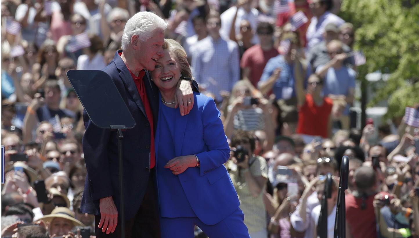 US Democratic presidential candidate Hillary Clinton is embraced by her husband, former president Bill Clinton, after she delivered her "official launch speech" at a campaign kick-off rally in Franklin D. Roosevelt Four Freedoms Park on Roosevelt Isl