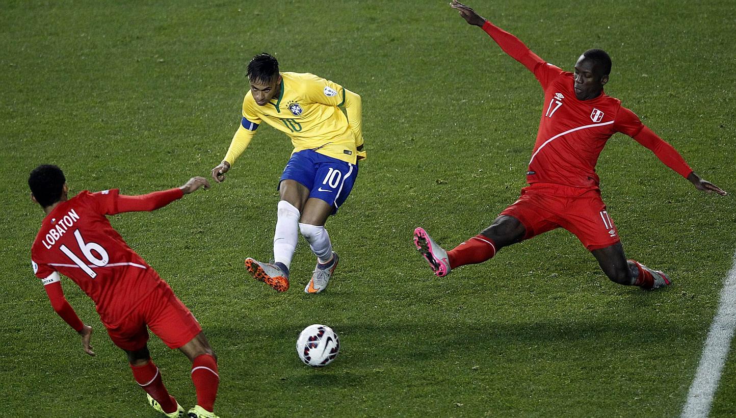Brazil's forward Neymar (centre), Peru's midfielder Carlos Lobaton (left) and Peru's defender Luis Advincula vie for the ball during their 2015 Copa America football championship match, in Temuco, Chile, on June 14, 2015. Brazil won the match 2 - 1. 