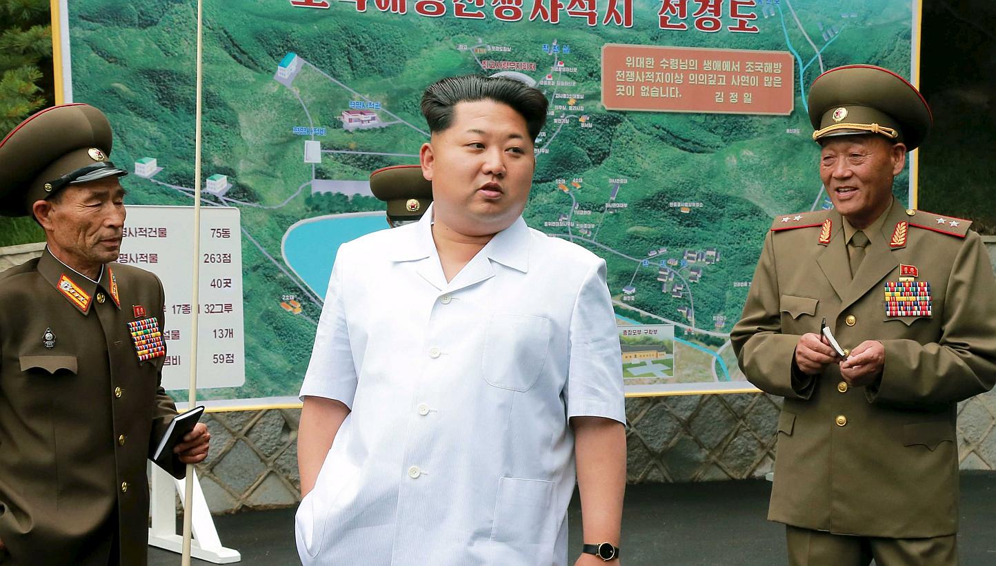 North Korean leader Kim Jong Un (centre) gives field guidance at a historic site associated with the Korean War in this undated photograph released by North Korea's Korean Central News Agency (KCNA) in Pyongyang on June 9, 2015. -- PHOTO: REUTERS
