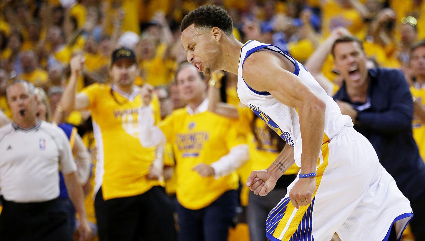 Stephen Curry of the Golden State Warriors celebrates in the second quarter against the Cleveland Cavaliers during Game Five of the 2015 NBA Finals at the Oracle Arena on June 14, 2015 in Oakland, California. -- PHOTO: AFP&nbsp;