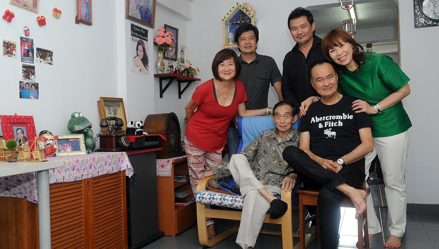 Mr Jolly Wee with his children (clockwise, from left) Sylvia, Bernard, Mervin, Dennis’ wife Priska and Dennis. -- ST PHOTO: TIFFANY GOH