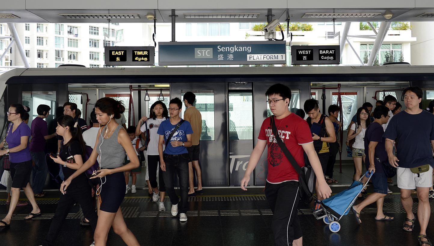 Commuters at the Sengkang LRT station. -- PHOTO: ST FILE 