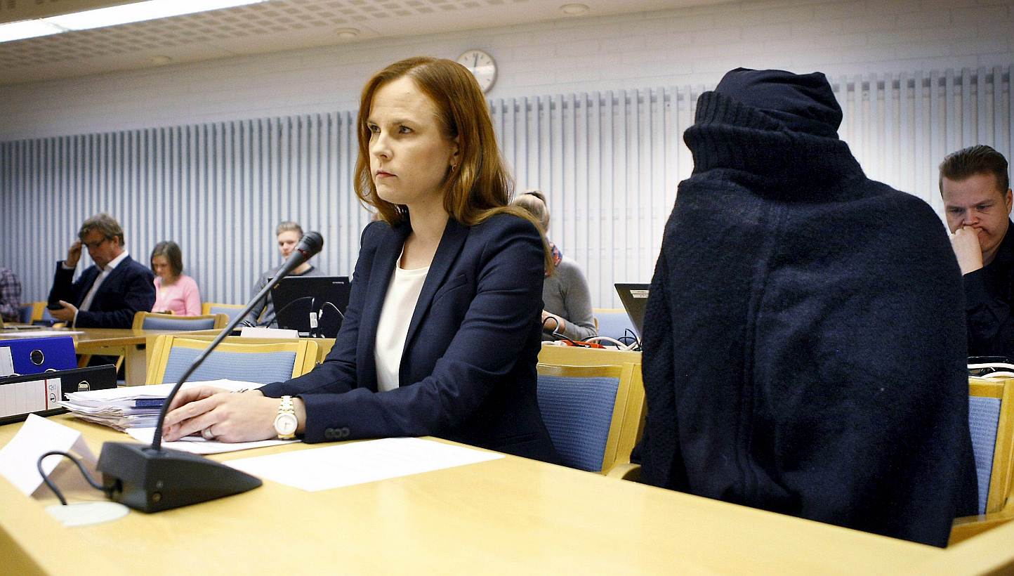 A picture taken on December 8, 2014 shows Meeri Palosaari (left), attorney of the prosecuted mother (right), during her trial for killing her newborns at the District Court of Oulu, Finland. -- PHOTO: AFP&nbsp;