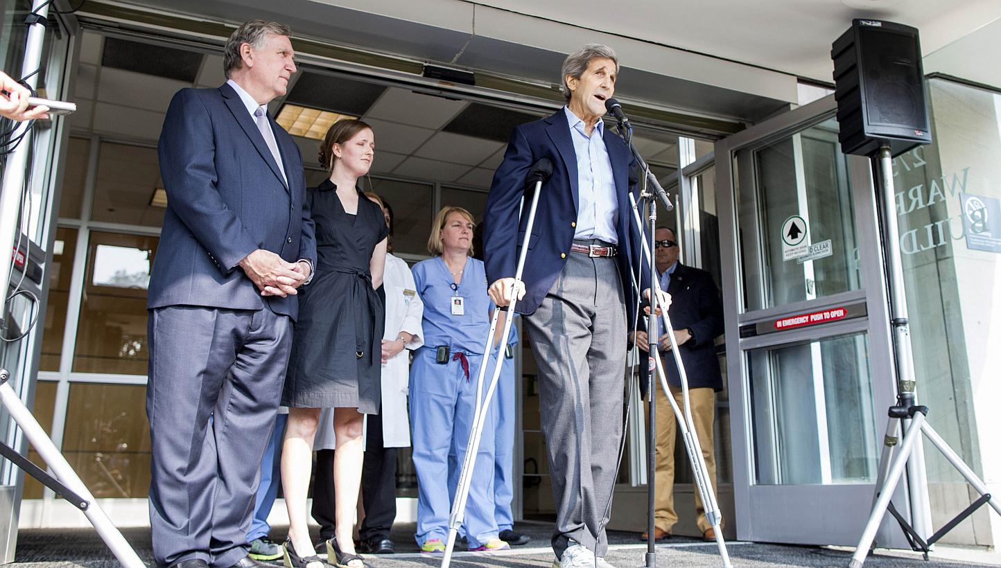 Secretary of State John Kerry speaks to the press on crutches after being discharged from Massachusetts General Hospital on June 12, 2015 in Boston, Massachusetts. Mr Kerry is taking nothing more than pain relief medicine Tylenol for his broken