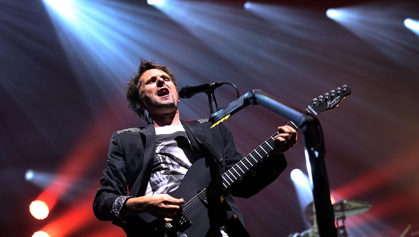 Matthew Bellamy of British rock band Muse performs at the Olympia concert hall in Paris. -- PHOTO: AFP