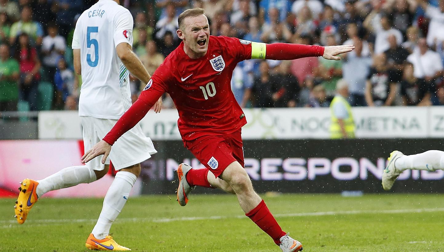 Wayne Rooney celebrates after scoring in the qualifier in Slovenia. -- PHOTO: REUTERS&nbsp;
