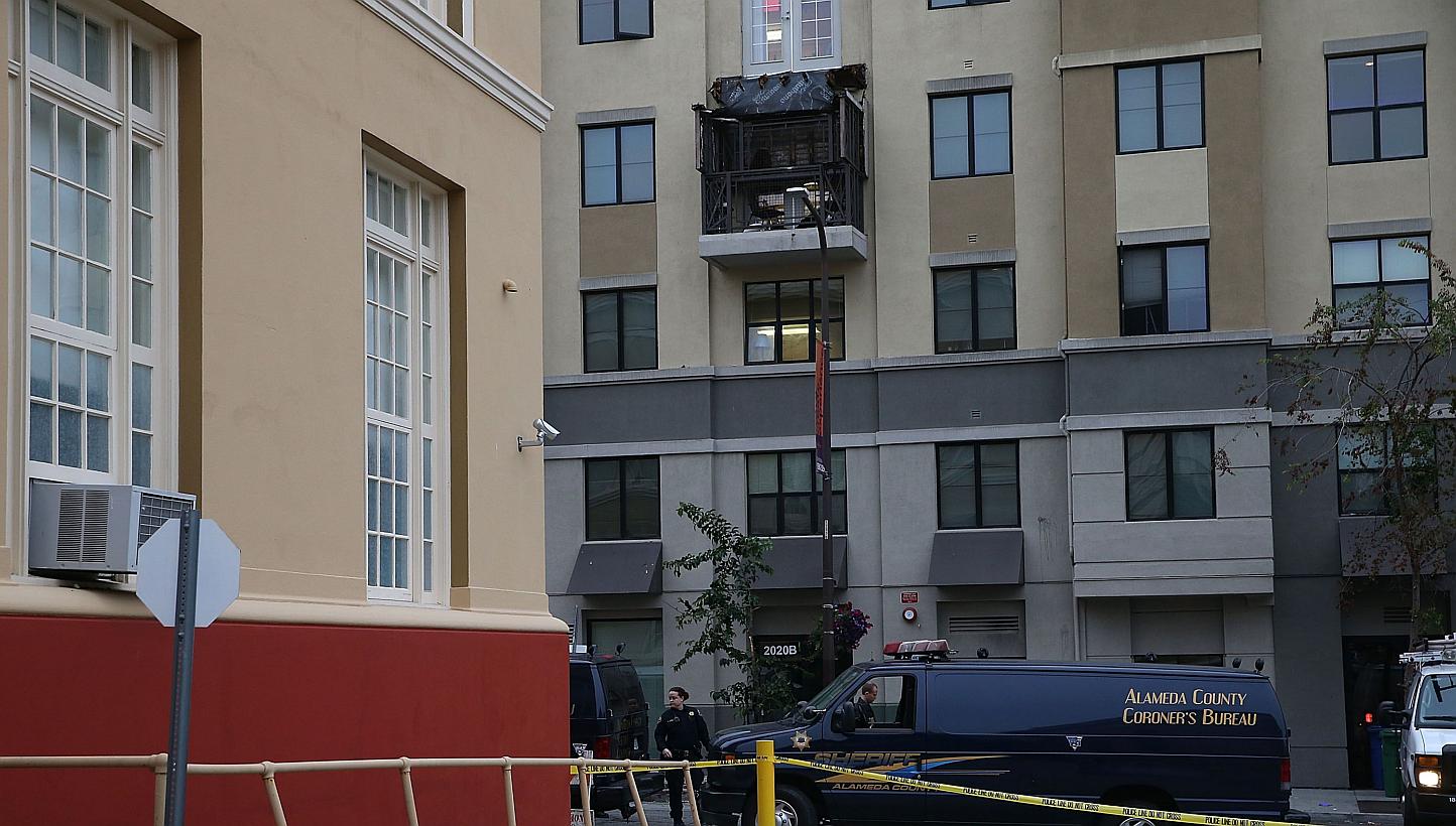 A coroner's vehicle sits parked at the scene of a balcony collapse at an apartment building near UC Berkeley on June 16, 2015, in Berkeley, California. -- PHOTO: AFP