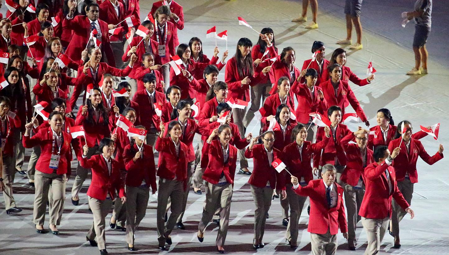 The Singapore contingent marching past during the opening ceremony of the 28th SEA Games at the Singapore Sports Hub on June 5, 2015. -- PHOTO: THE NEW PAPER