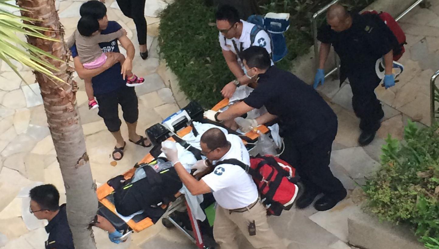 Medics attend to a seven-year-old boy rescued from a swimming pool at Resorts World Sentosa. He was later pronounced dead at Singapore General Hospital. -- PHOTO: WAN BAO 