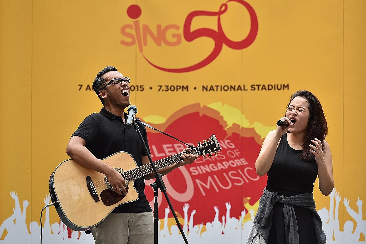 Mr Mohammad Zaini Khusin, 20, and Ms Faith Ng, 19, entertaining the crowd at yesterday's pop-up concert at Resorts World Sentosa.