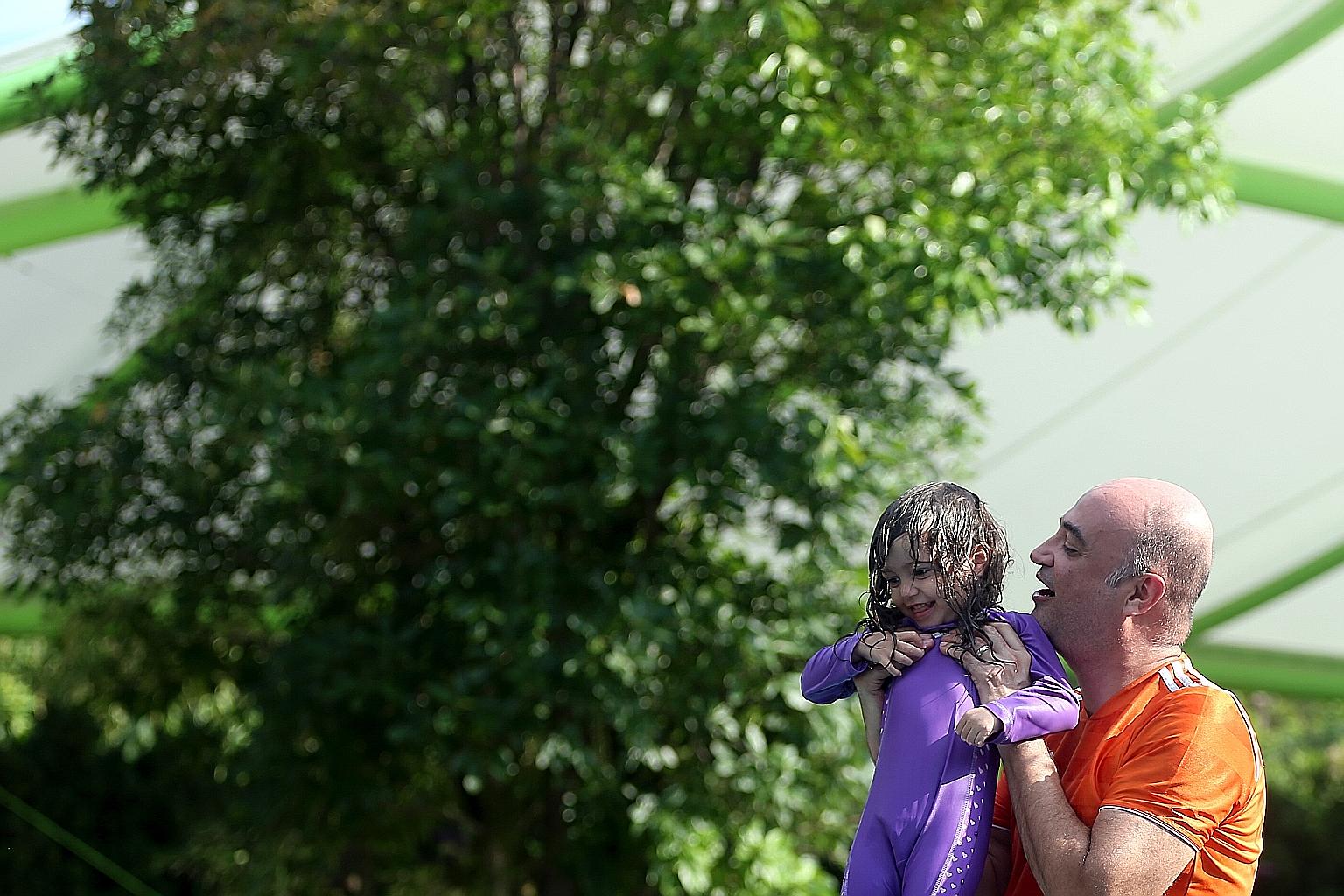 Stay-at-home dad Carlos Mari with his two-year-old daughter Carla. The Australian moved to Singapore four years ago when his wife was posted here by her employer. He joined an expatriate mothers' group initially, but last year started his own informa