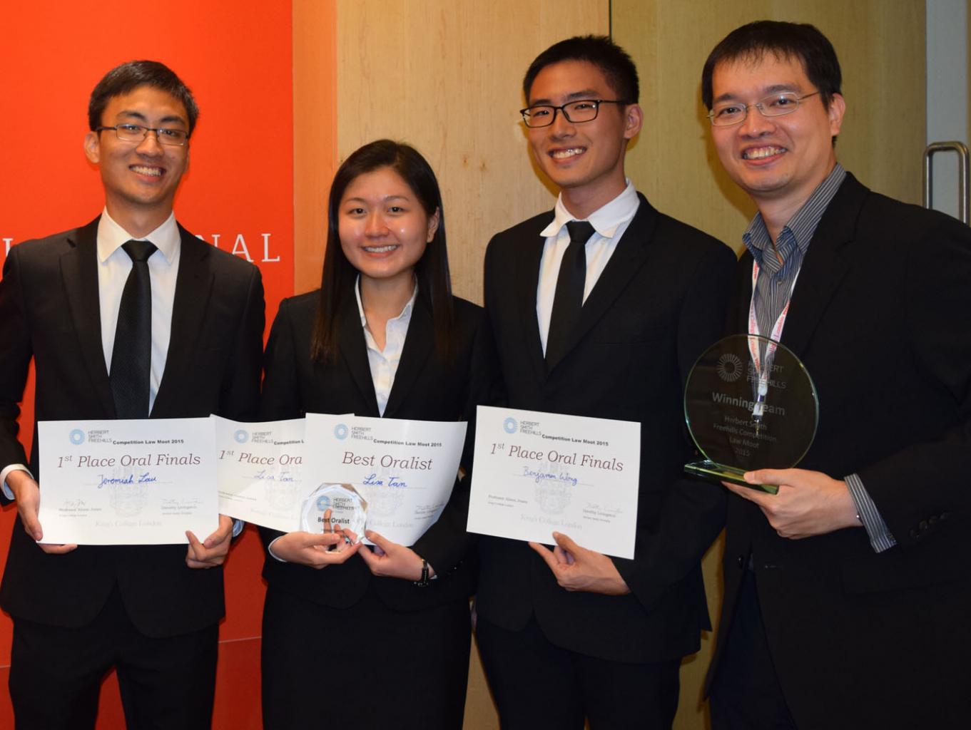 NUS law students (from left) Jeremiah Lau, Lisa Tan and Benjamin Wong with their coach, Associate Professor Burton Ong. Ms Tan also won the Best Oralist award, while Mr Lau and Mr Wong finished as joint runners-up.