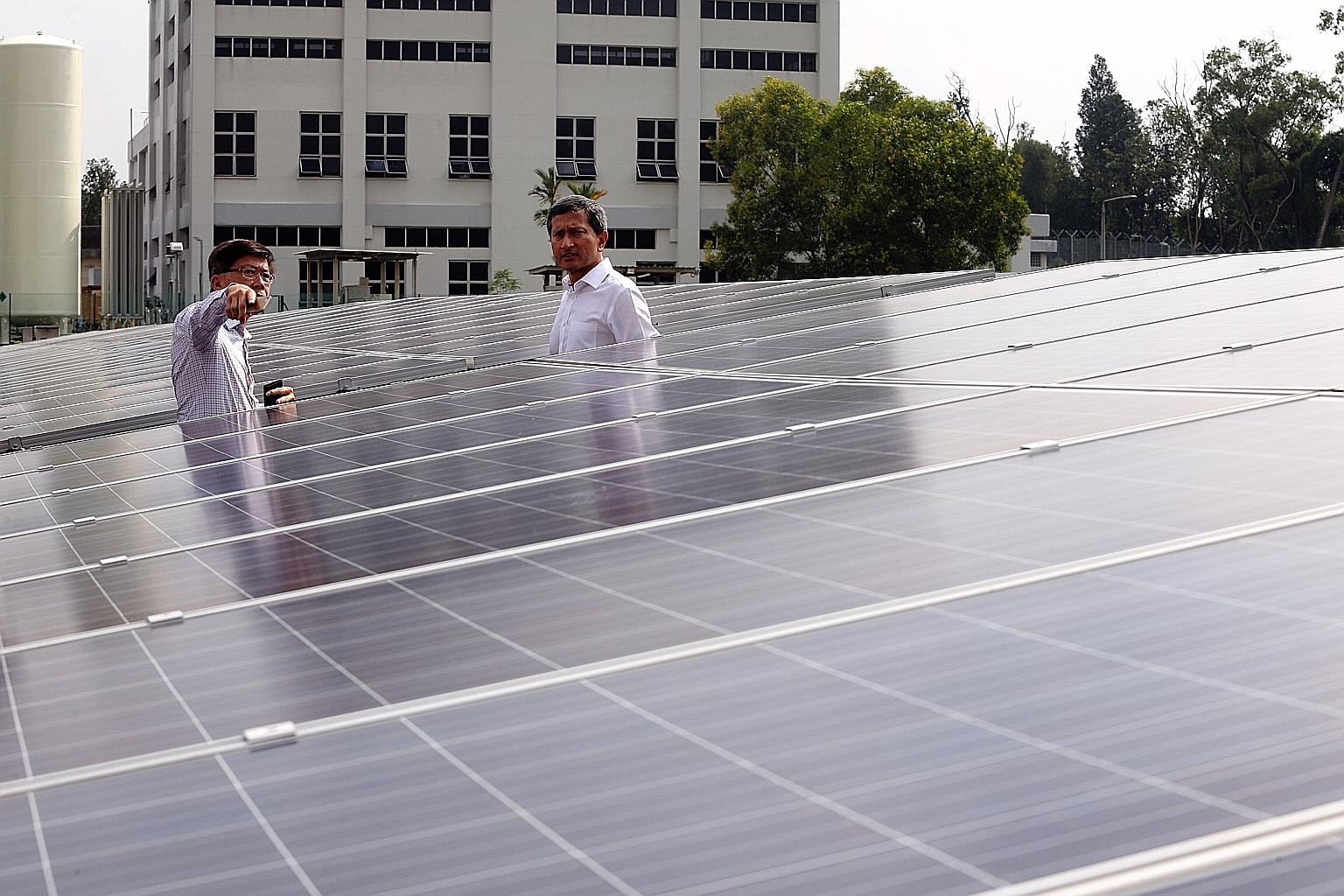 Minister for the Environment and Water Resources Vivian Balakrishnan on a tour of Choa Chu Kang Waterworks yesterday. With him was Mr Albert Lim, managing director of SolarGy, which installed the solar panels.