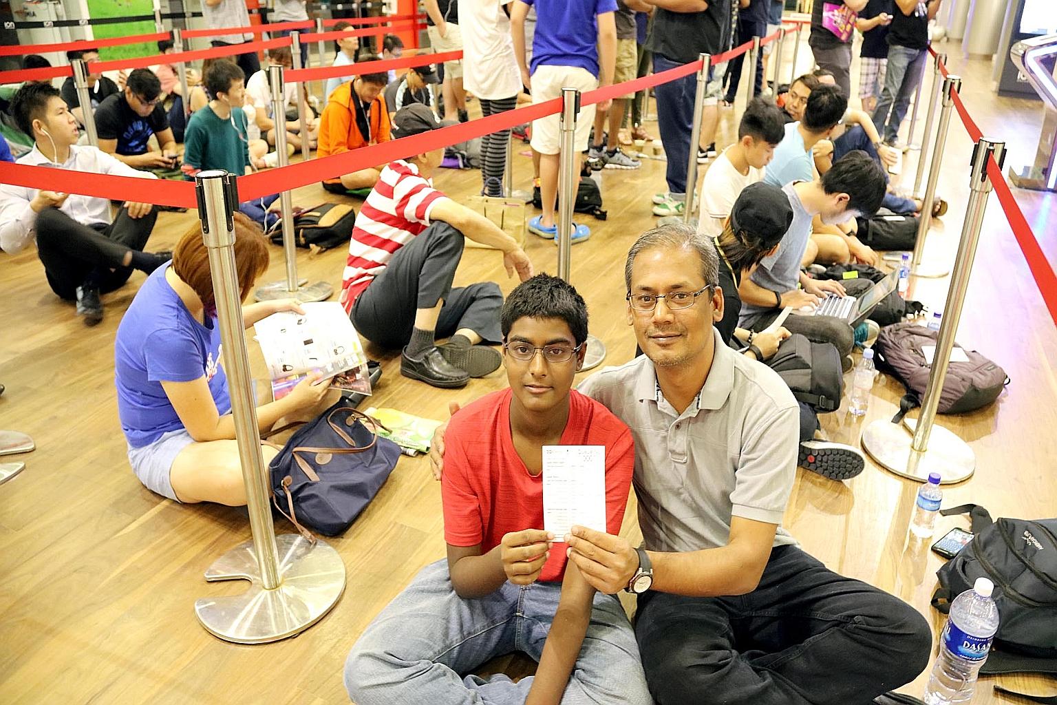 Student Sriram Rengamannar and his father, Mr Renga Mannar, were first in line to buy the Apple Watch yesterday after a 12-hour wait at Ion Orchard's EpiCentre store. "I was too excited to sleep," said the 13-year-old.