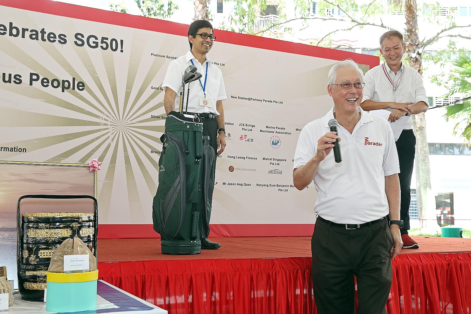 Emeritus Senior Minister Goh Chok Tong put up for auction his personal items, such as a set of golf clubs, to raise funds for vulnerable residents in Marine Parade at yesterday's carnival. Parliamentary Secretary for Health and Transport Muhammad Fai