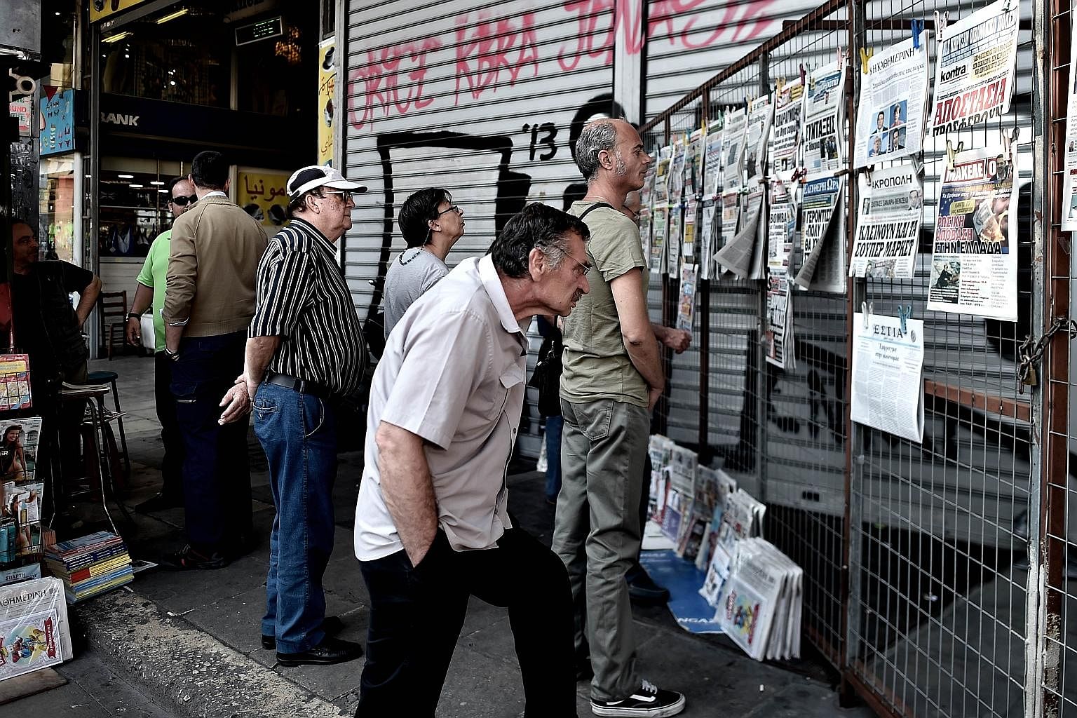 Reactions in Greece to the debt crisis are vastly contrasting. On one of its remote islands, the issue is barely mentioned, unlike in Athens (above), where the discussion never strays far from the crisis.