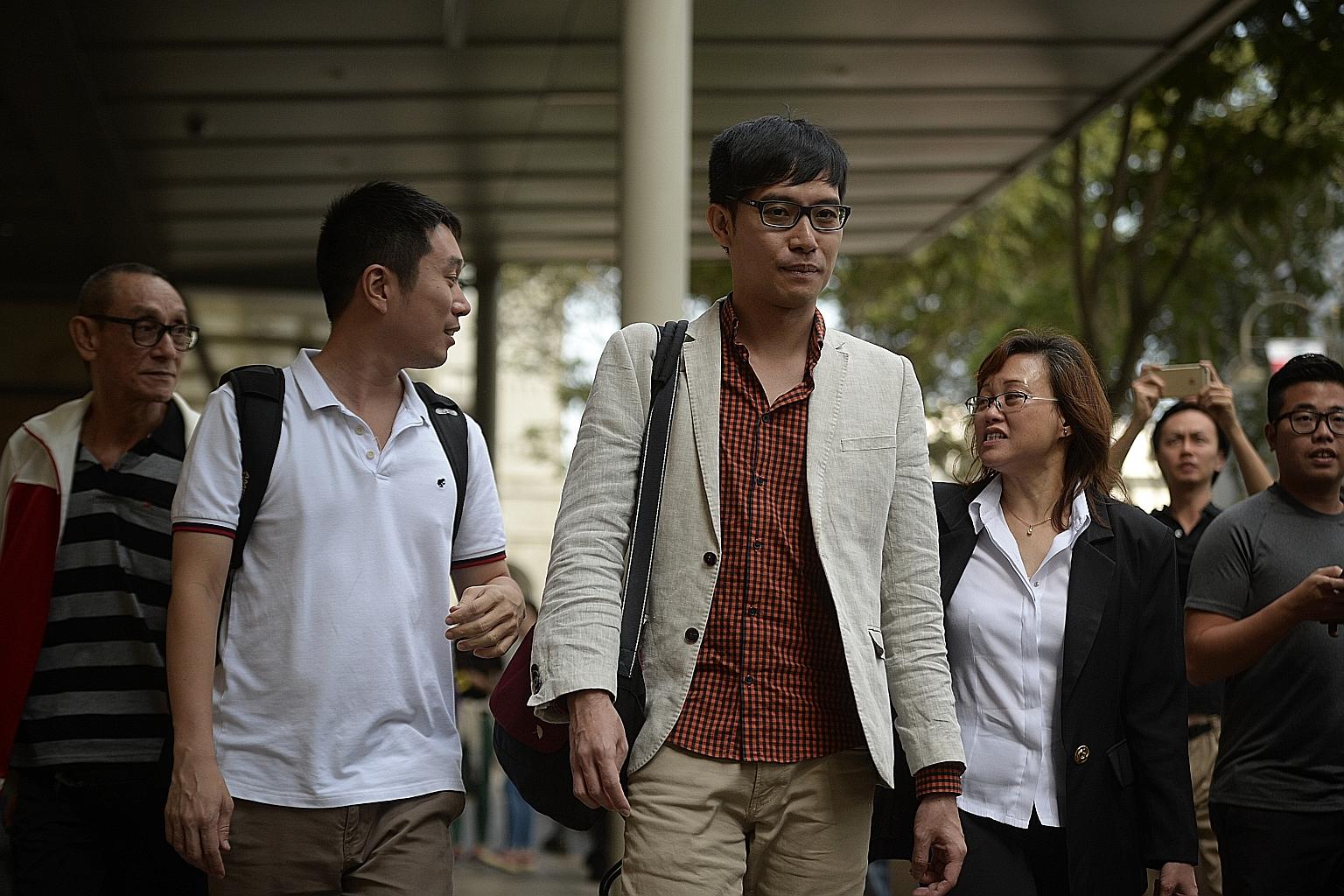 Mr Roy Ngerng (centre) was ordered to pay $6,000 to PM Lee for the unsuccessful bid to hire a QC.