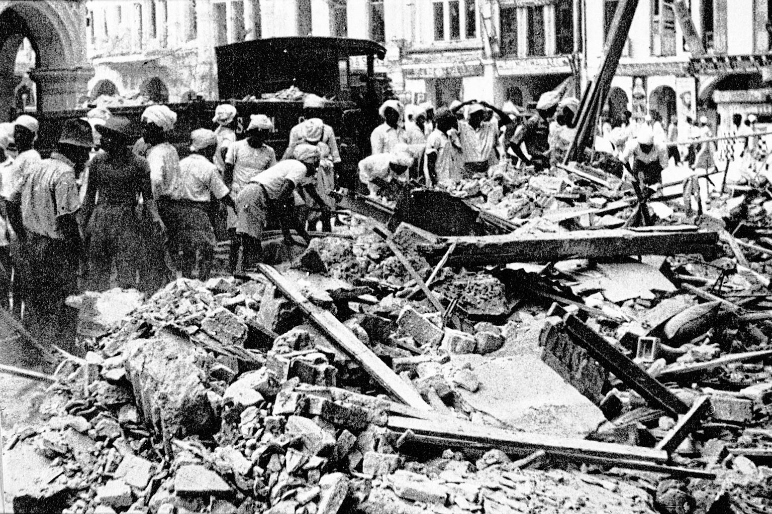 Workmen clearing the rubble (left) following a Japanese air raid on Singapore in 1942. The back page of The Straits Times on Jan 30, 1942, carried "An air raid alphabet" (below) for readers to cut out and keep for reference.PHOTO: ARGUS NEWSPAPER COL