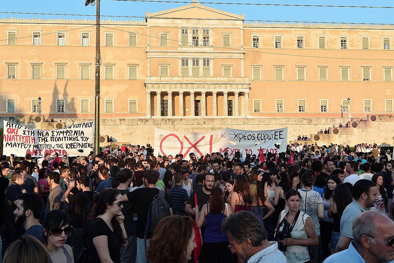 Protesters in an anti-EU demonstration in Athens on Monday rallying against the deal struck between Greece and its European creditors. Under the deal, Athens must push through draconian reforms in a matter of days.