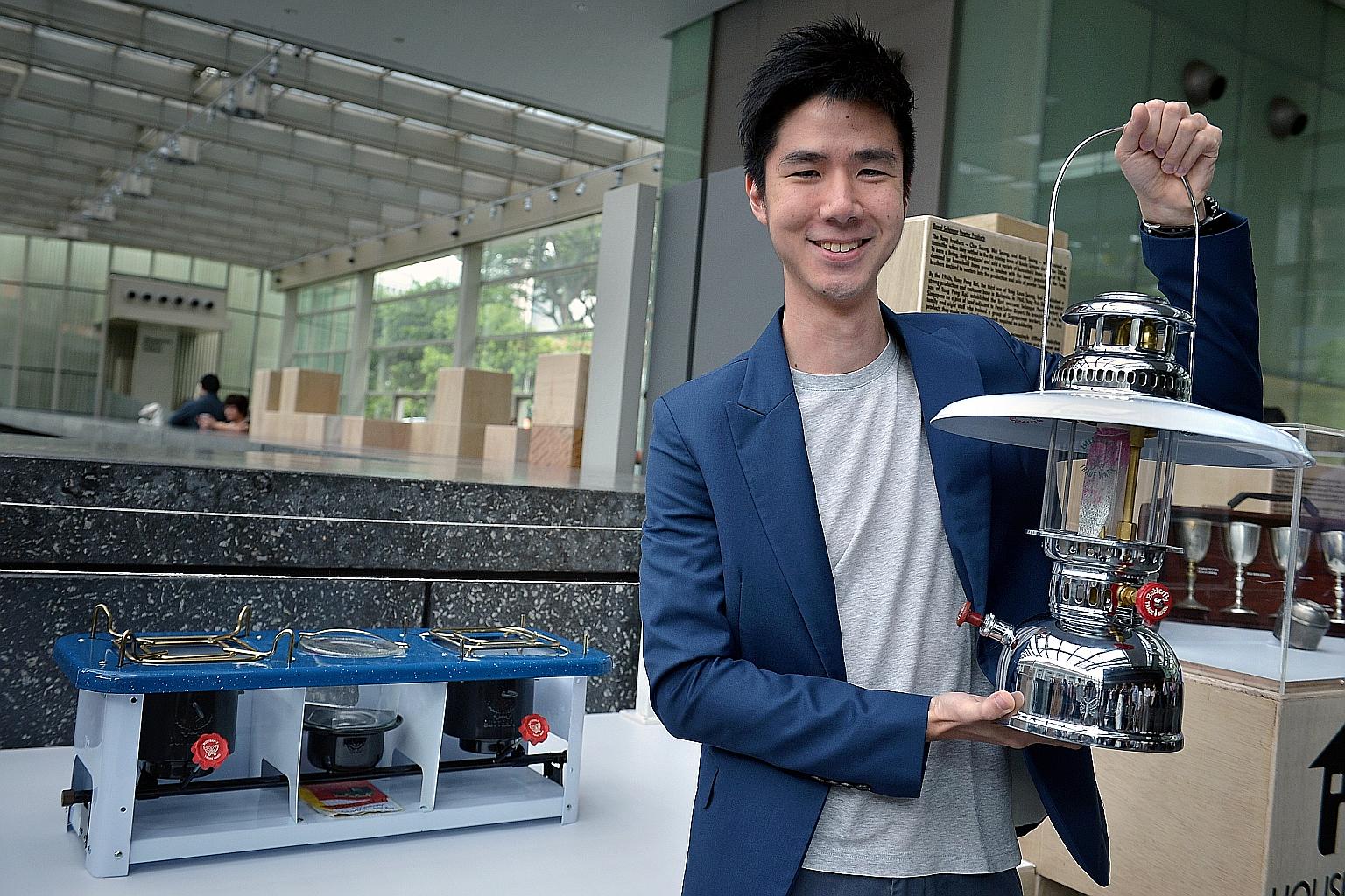 Mr Woo Ren Chai, director of Lea Hin, with one of the kerosene lamps the family-owned business makes.