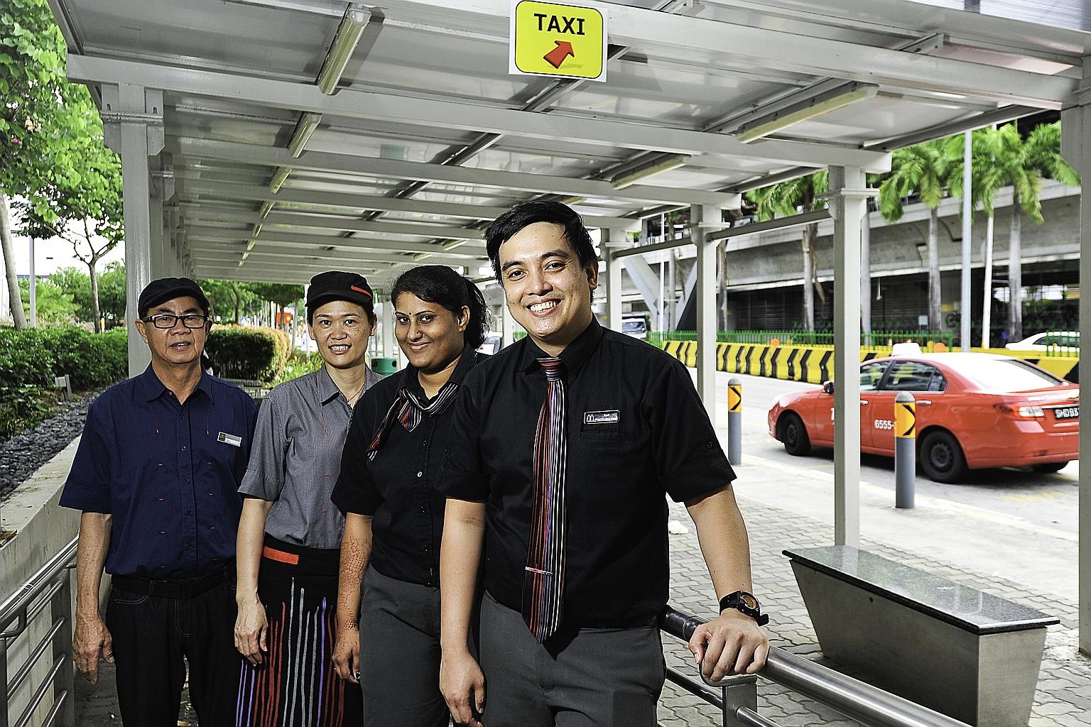 Mr Karl Alvendia Rodriguez (right) with fellow McDonald's staff (from left) Mr Hoo Hang Chai, Ms Ng Chai Eng and Ms Komala Devi Maniam. A photo of Ms Komala and her colleagues giving out drinks was posted on Twitter, where it received much praise fro