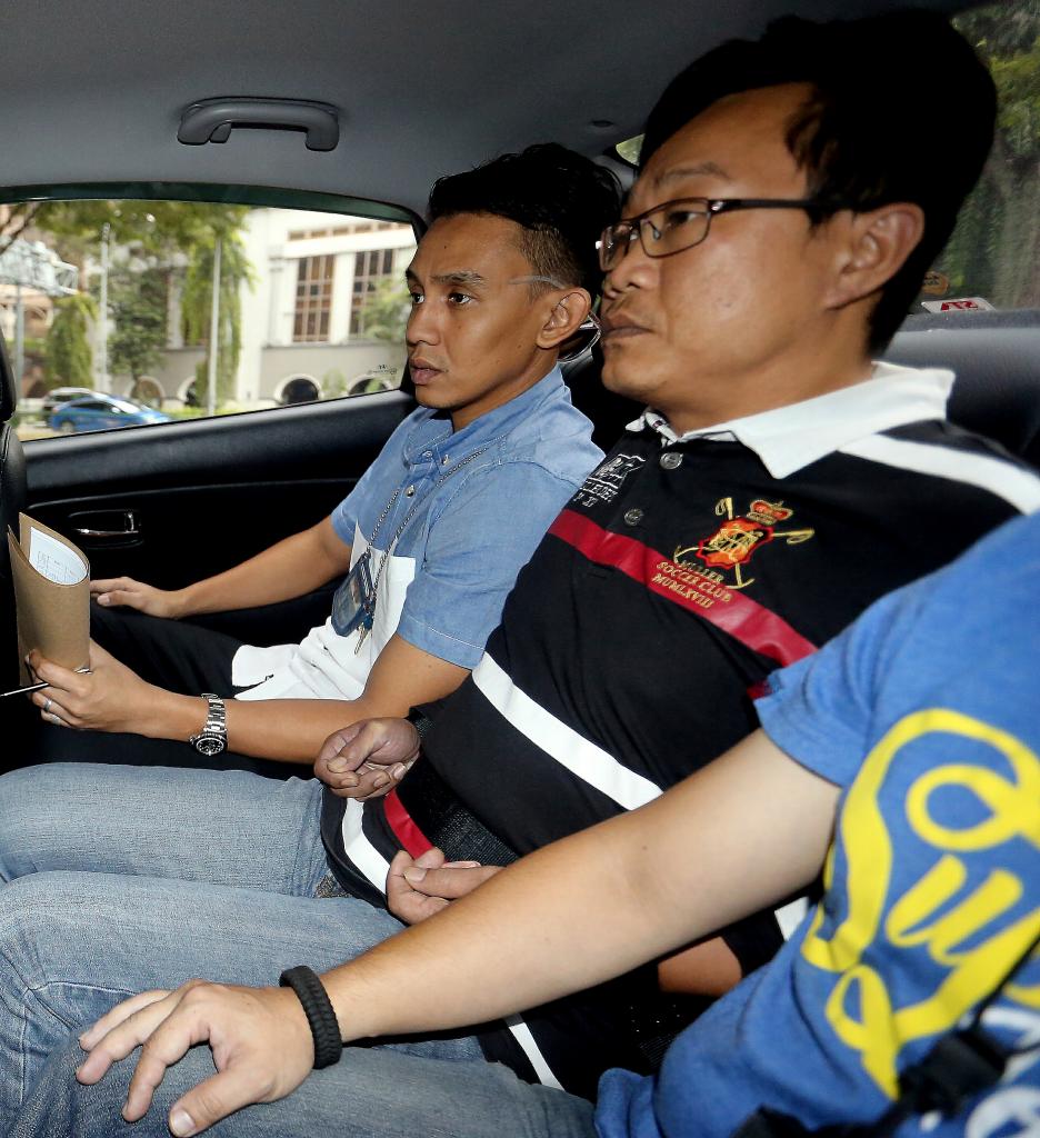 Ho Yueh Keong (right), who had been on the run for nine years, is charged with harbouring Tan Chor Jin, who had killed a nightclub owner in 2006. Ho allegedly helped Tan flee the law after the murder. 