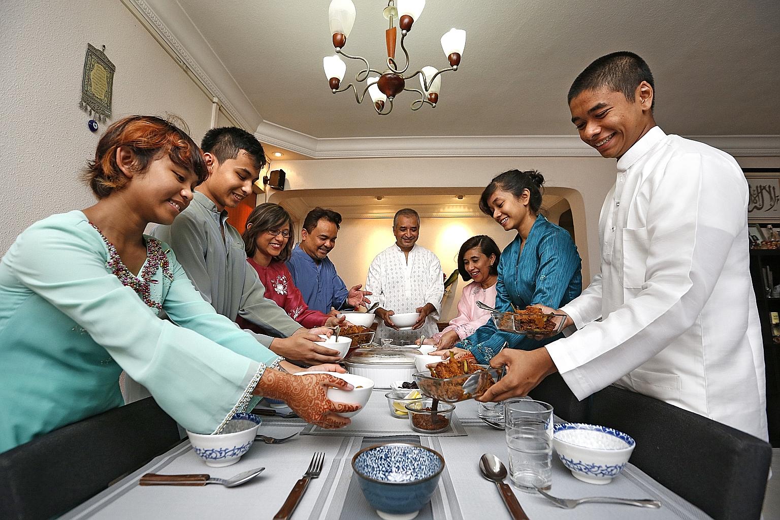 It's a Hari Raya family feast for (from left) Nadya Ambar Agustono, 12; Vian Ambar Agustono, 15; their parents Shirin Hamid, 48, and Ambar Machfoedy, 47; Mr Abdul Nasheer Abdul Kader, 51; his wife Zabrina Hamid, 50; and their children Parizad, 15, an