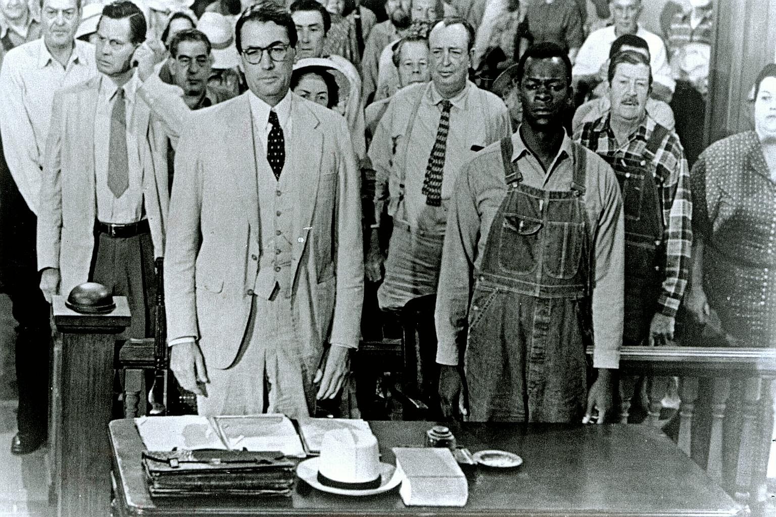 Atticus Finch was given life by Gregory Peck (left) in the 1962 Oscar-winning film, in which Brock Peters (right) played Tom Robinson.