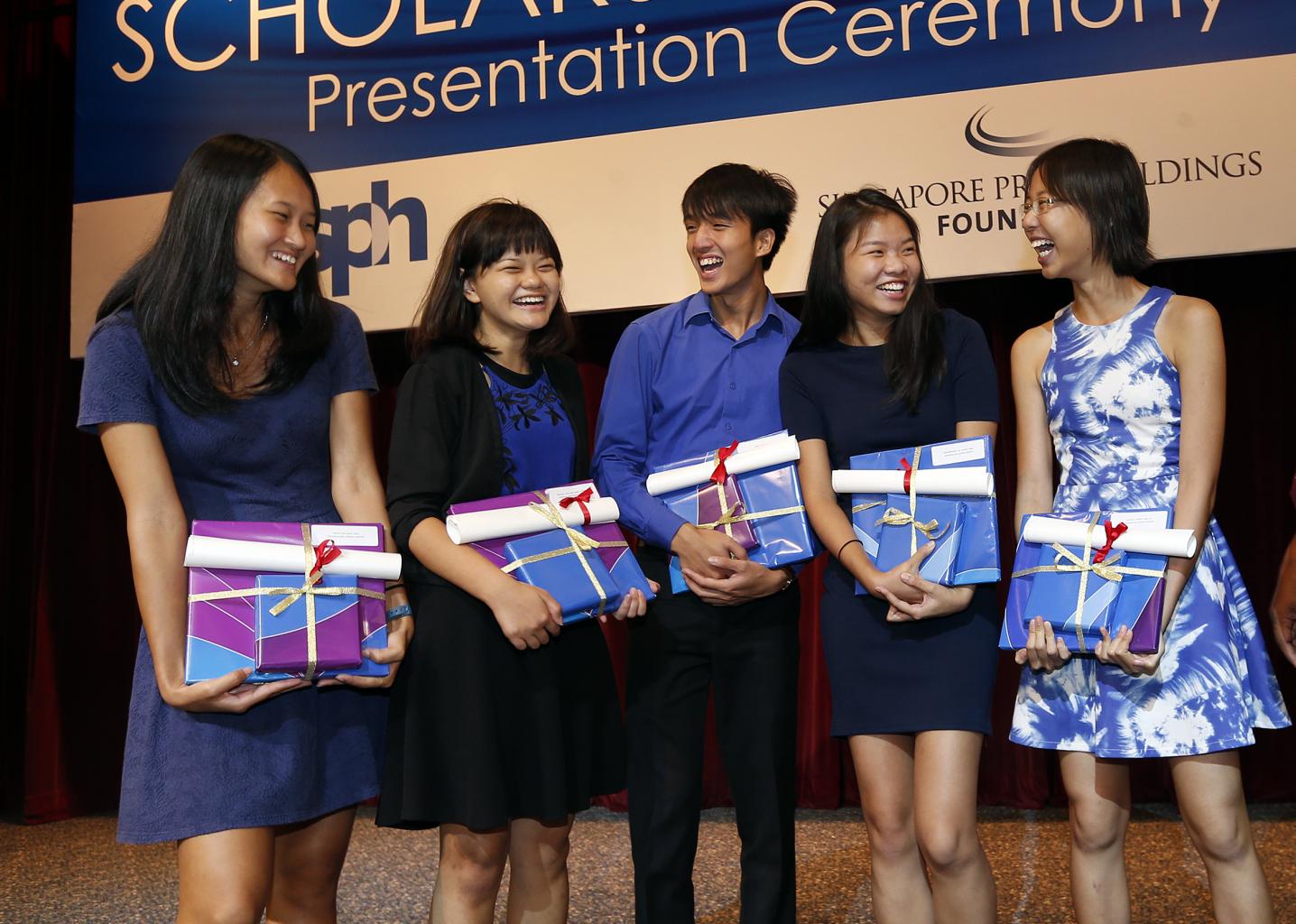 The SPH journalism scholarship recipients are (from left) Ms Jean Lau, 20; Ms Prisca Ang, 19; Mr Yap Jun Weng, 21; Ms Charmaine Ng, 22; and Ms Clara Chong, 19. Ms Chong, who is a sports intern reporter with The Straits Times, said she is looking forward t