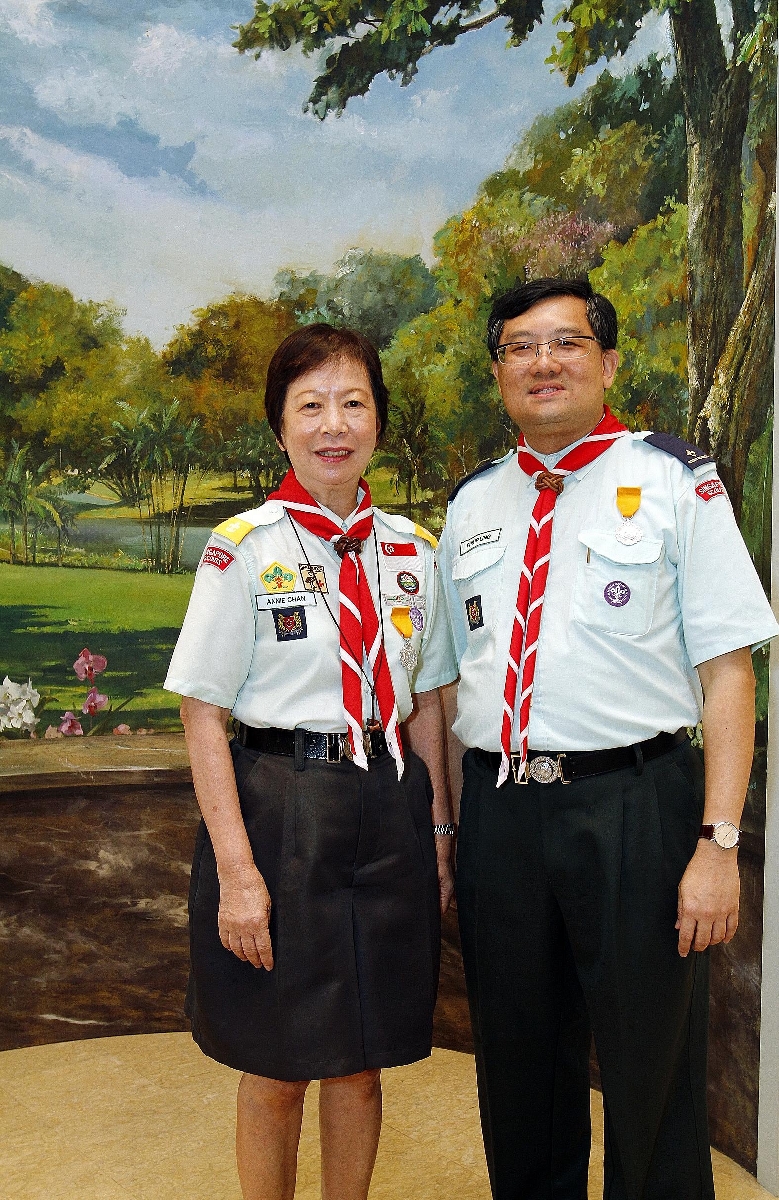 Teacher Annie Chan and auditor Philip Ling were among 35 adult scout leaders to receive Distinguished Service Awards at the Istana yesterday. The annual scout awards were handed out by President Tony Tan Keng Yam, who is also Chief Scout. Mrs Chan, 6