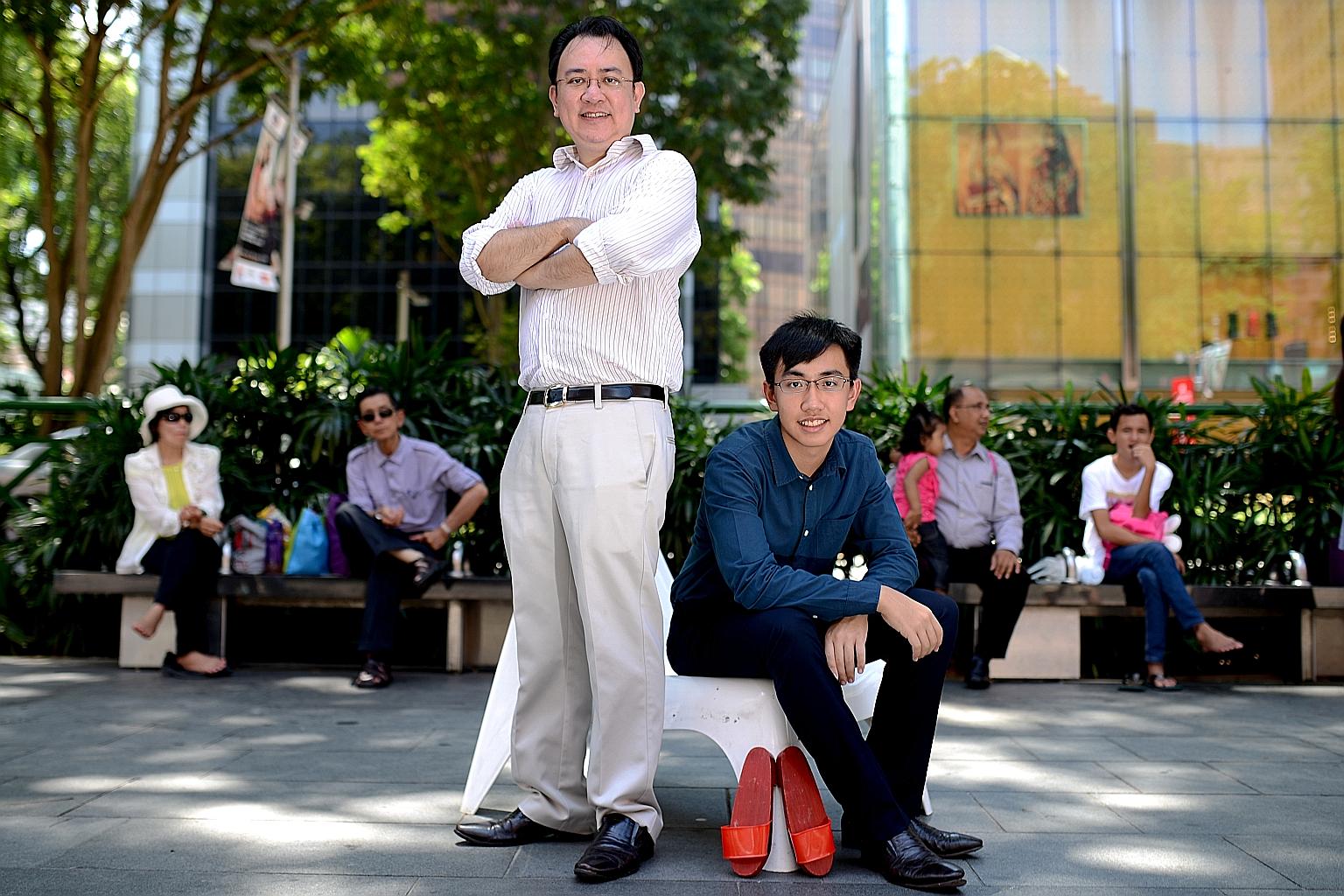 Mr Markus Tay, secretary- general of Singapore Kityang Huay Kwan Youth Wing, registered his son Viari (both left) for a Teochew coming-of-age ceremony.