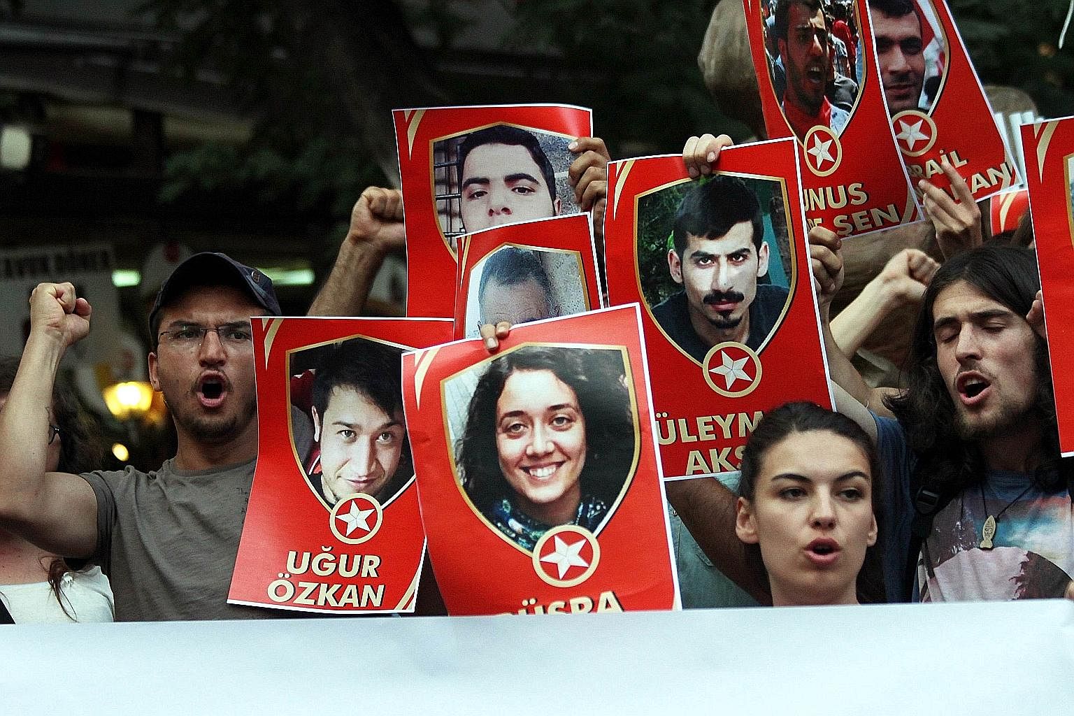 Demonstrators in Ankara displaying pictures of terror victims on Monday as they chanted slogans denouncing a suicide bombing in the Turkish border town of Suruc on July 20 that killed 32 people.