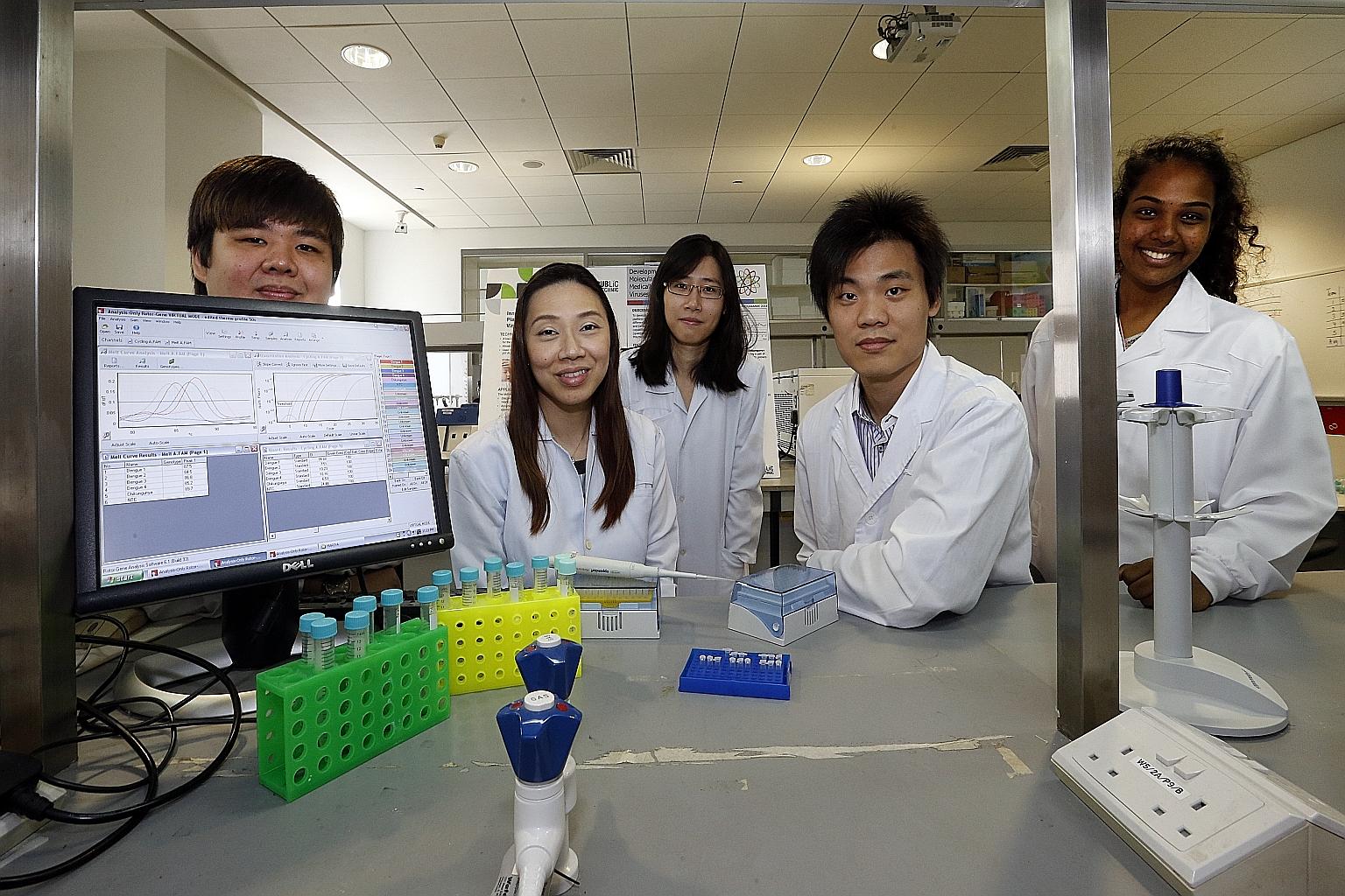 The team that collaborated on the project to develop the diagnostic kit included (from left) Mr Ivan Foo Zhi Kwee, 20; Dr Ho Phui San, 37; Miss Dawn Tan Yu Bin, 21; Mr Chen Huixin, 28; and Miss Mariya Parimelalagan, 22.