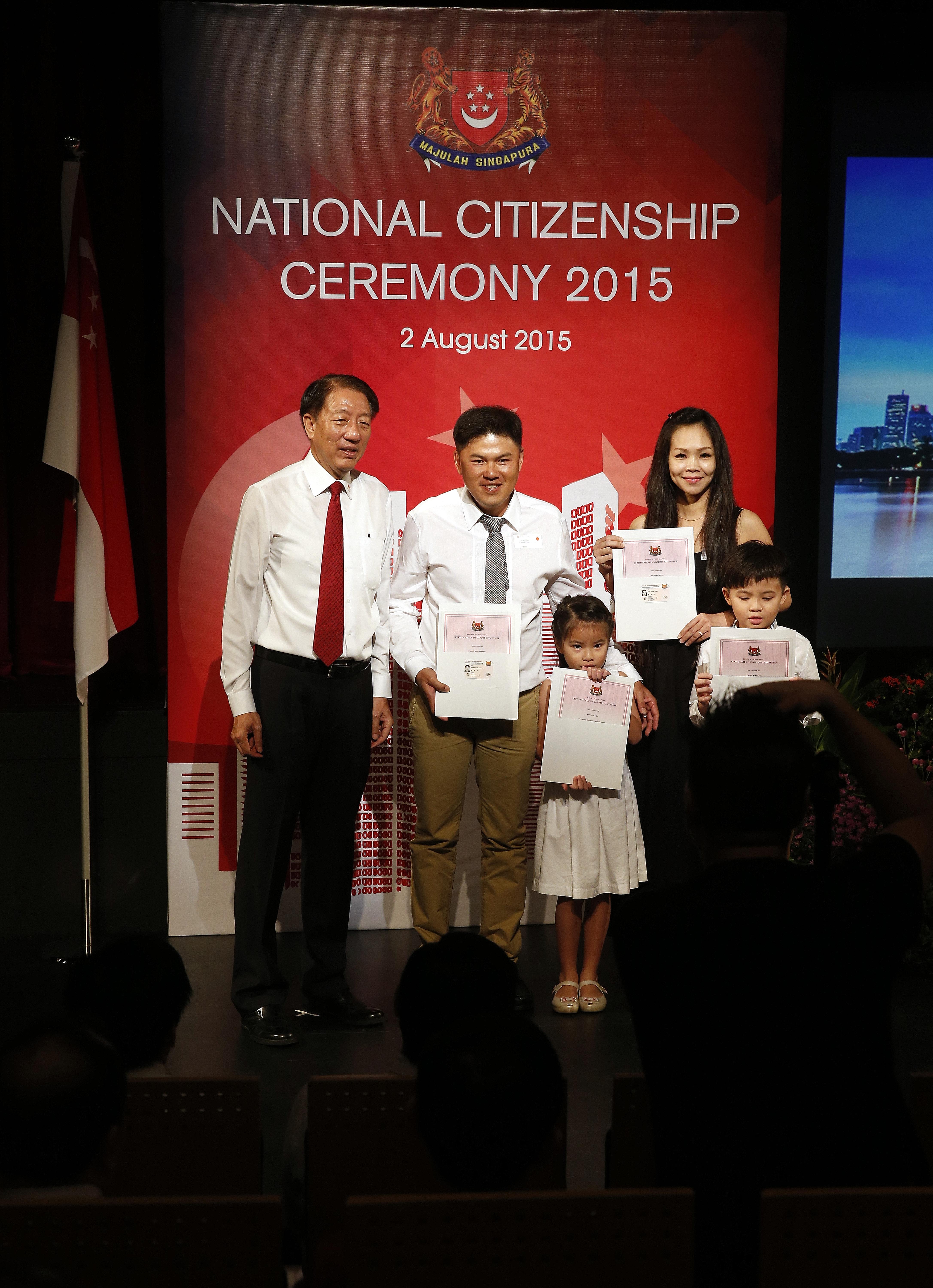 (From left) DPM Teo with new citizens and Pasir Ris-Punggol residents Chong Kuin Sheong, 37; Ke Qi, Mr Chong's six-year-old daughter; wife Chai Yoon Fong, 37; and son Hao Yan, eight.
