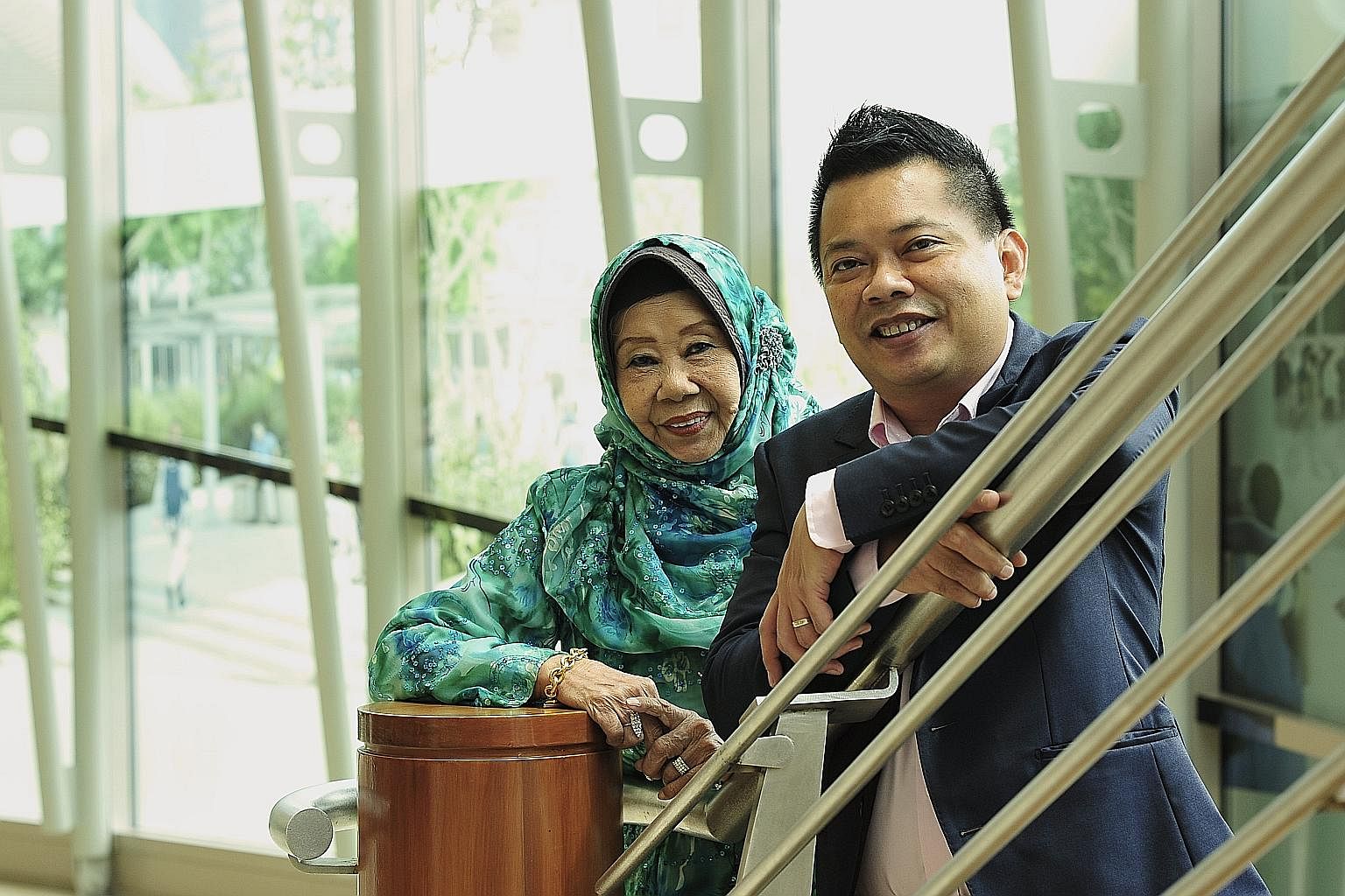Veteran singer Nona Asiah and her son, music arranger Indra Shahrir Ismail (both top); and host Najip Ali (above).