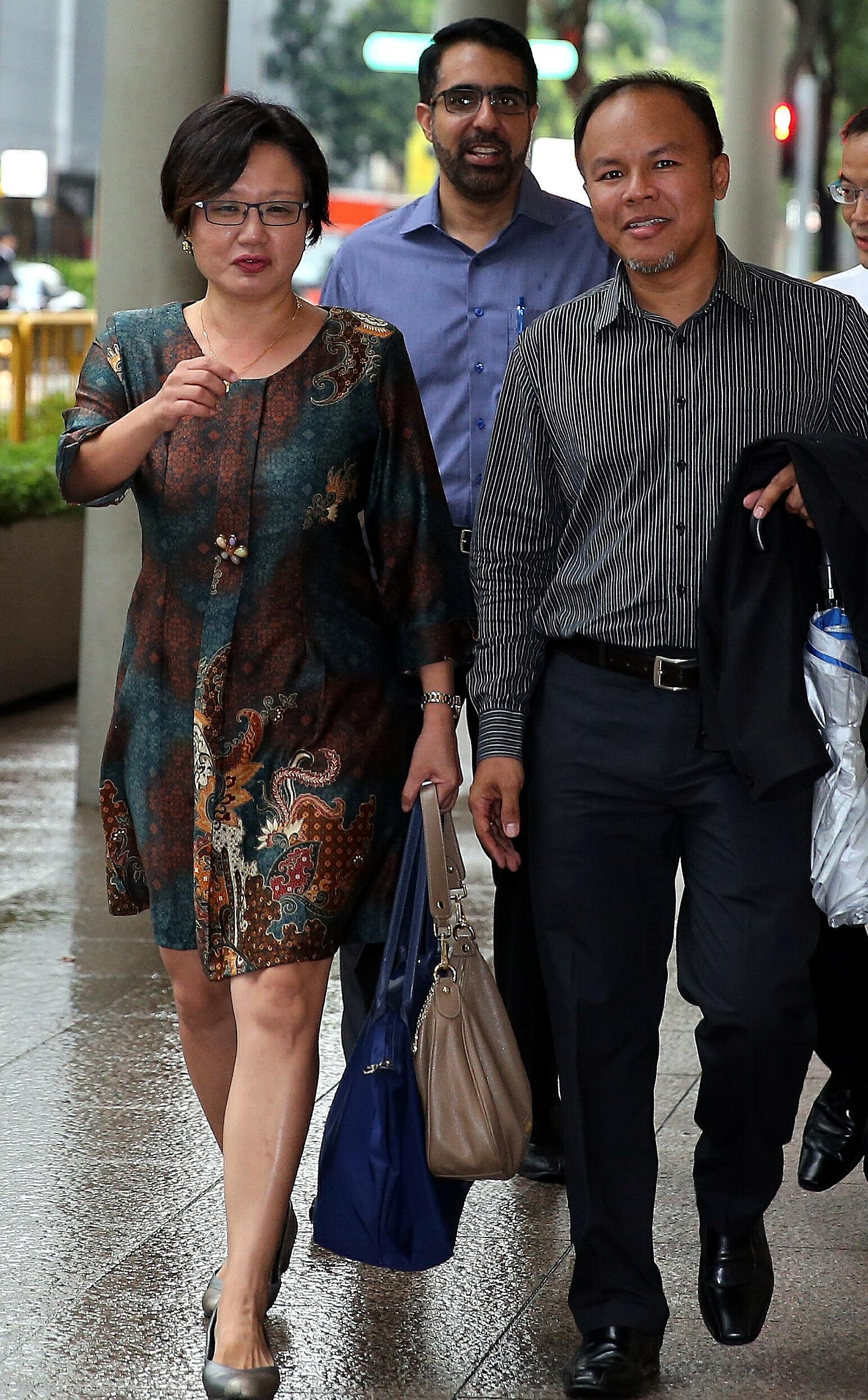 (From left) Workers' Party and AHPETC chairman Sylvia Lim arriving at the Supreme Court yesterday with fellow Aljunied GRC MPs Pritam Singh and Muhamad Faisal Abdul Manap.