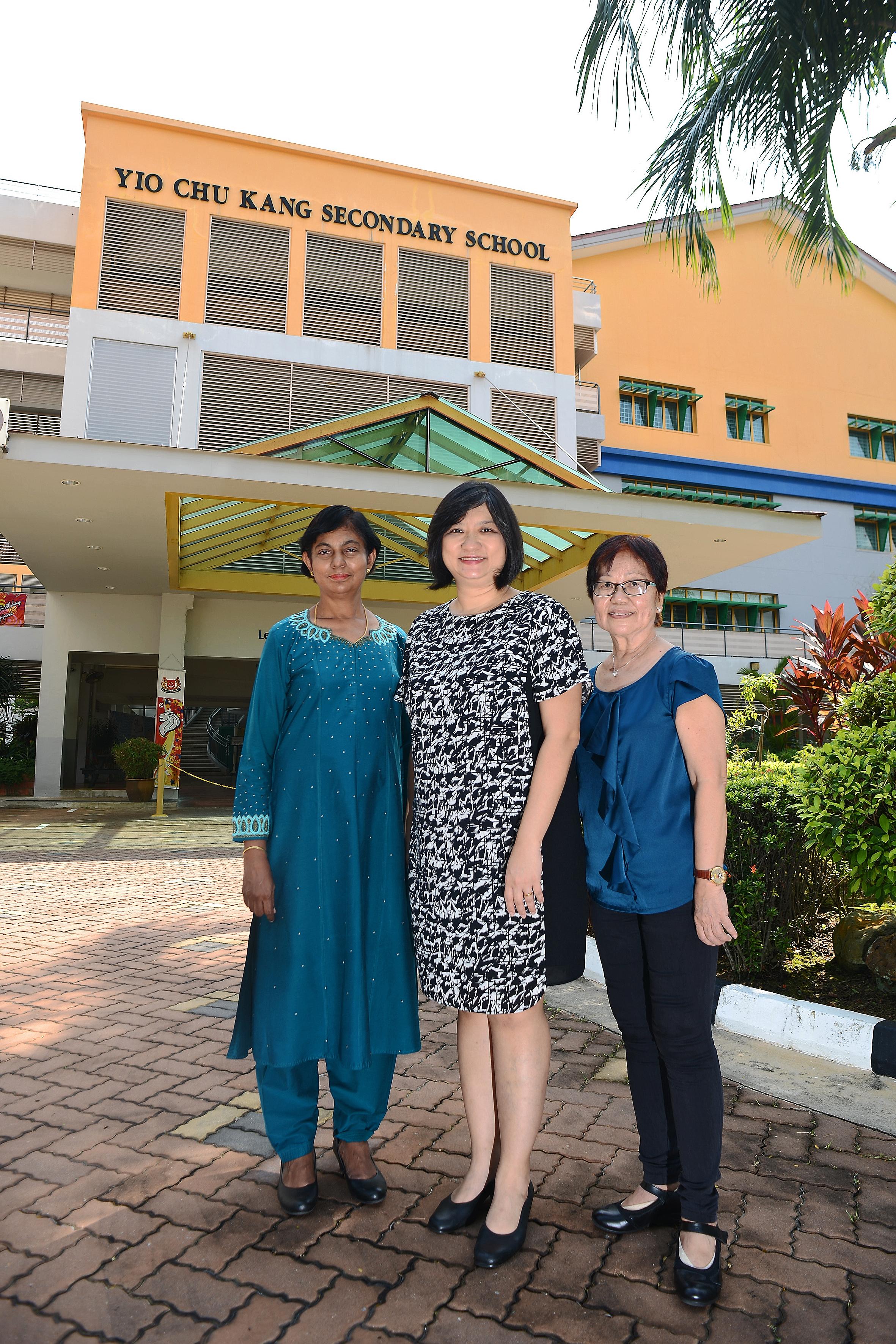 Yio Chu Kang Secondary's principal Janice Heng (centre) with maths teacher Annie Matthews (left), who joined the school in 1984, and contract teacher Mak Pak Lum, who joined in 1975.