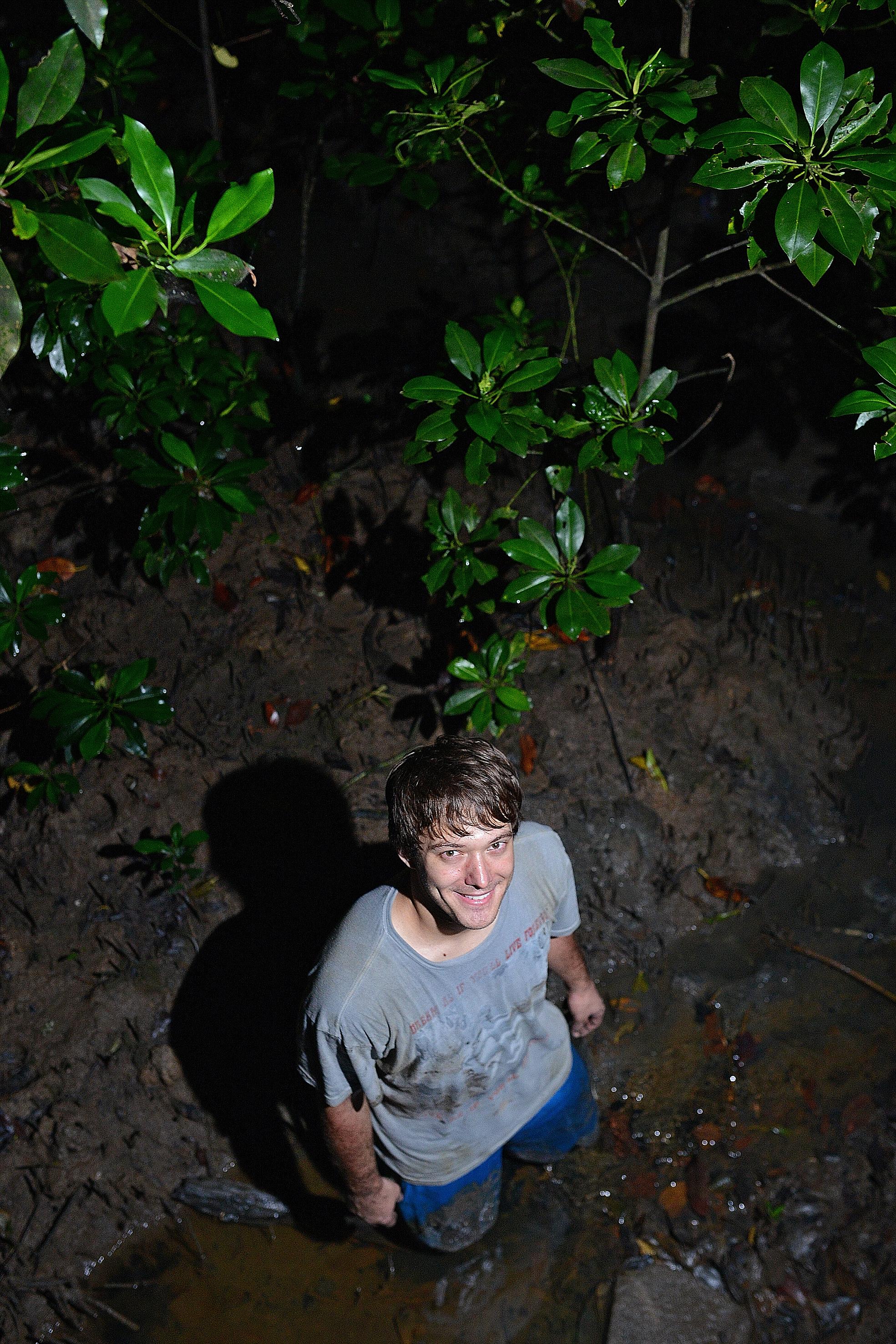 Researcher Phil Vogrinc has been wading through mud to look for water snakes for a survey that is believed to be the first of its kind here. The US student, who is attending a summer course at NUS, decided to study snakes here because Singapore lies 