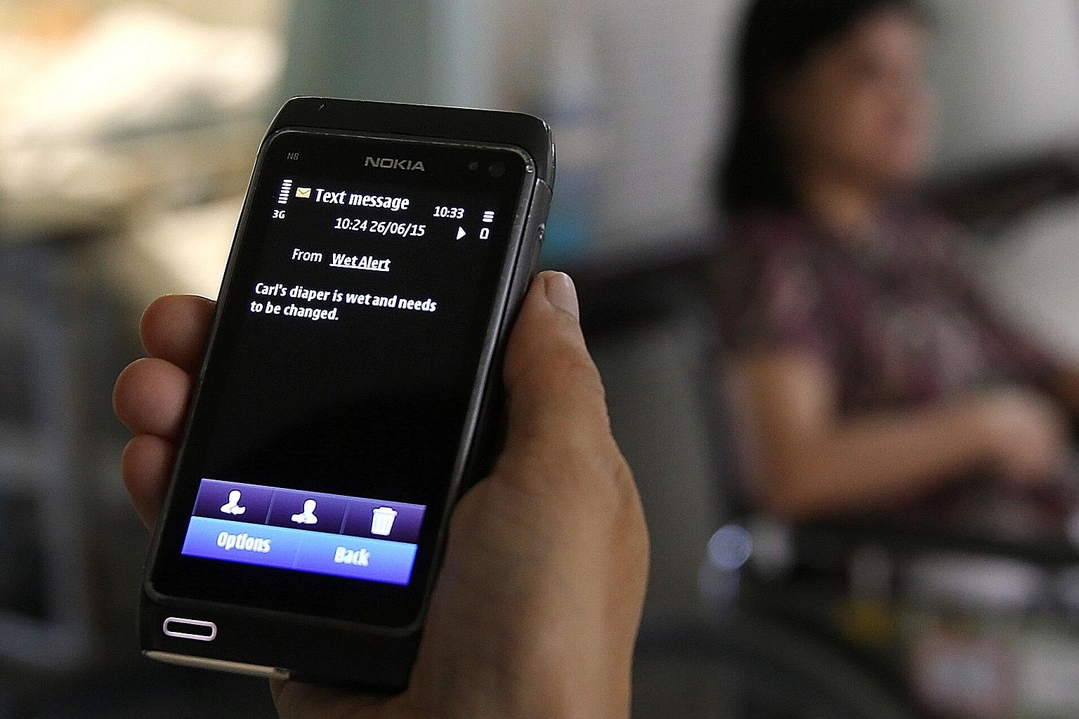 A sensor clipped onto an adult diaper triggers an alert on a nursing home's computer and sends an SMS to a nurse's mobile phone when a patient's diaper needs to be changed.