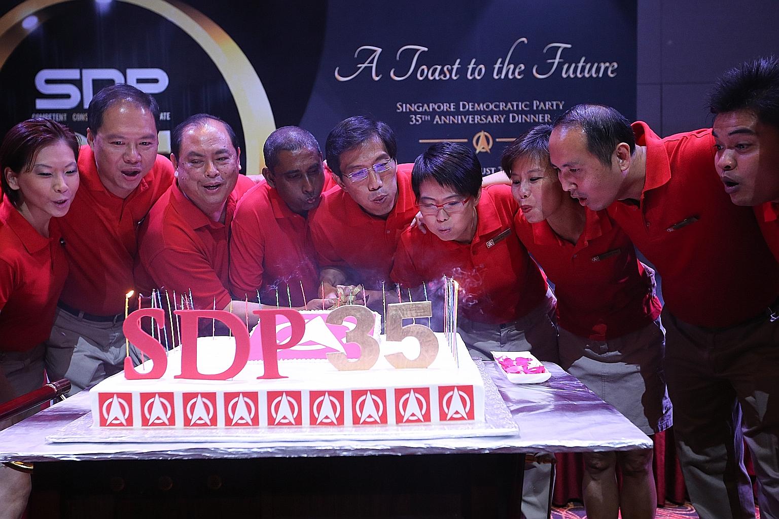 Members of the SDP Central Executive Committee at last night's anniversary event: (from left) Assistant treasurer Jaslyn Go, assistant secretary-general Christopher Ang, vice-chairman John Tan, chairman Jeffrey George, secretary-general Chee Soon Jua